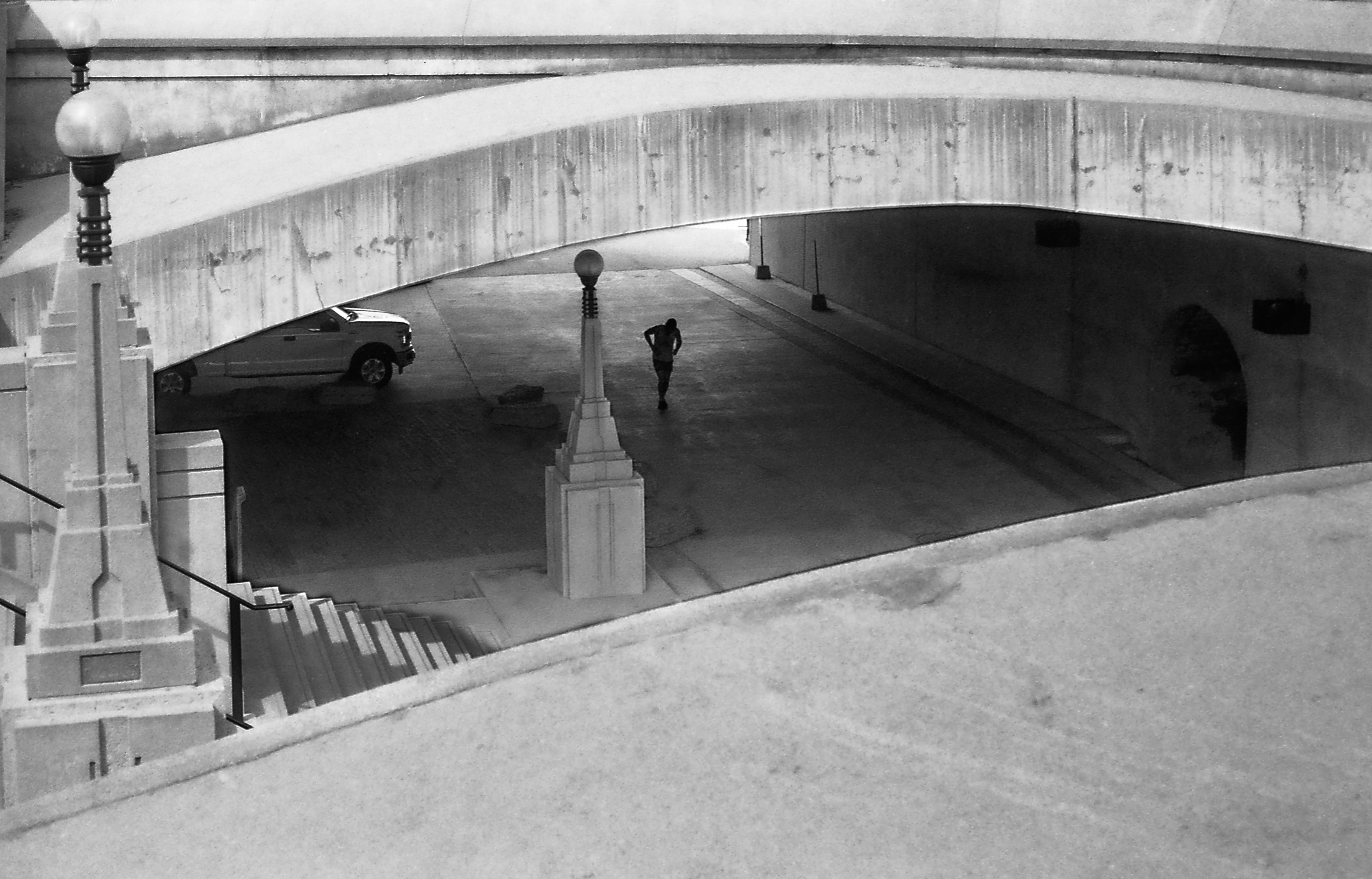 Under the Bridge Ottawa - 135 film "You could hear the echoes of his feet hitting the pavement softly with each kick of the sack." Beautiful lines, form & story.