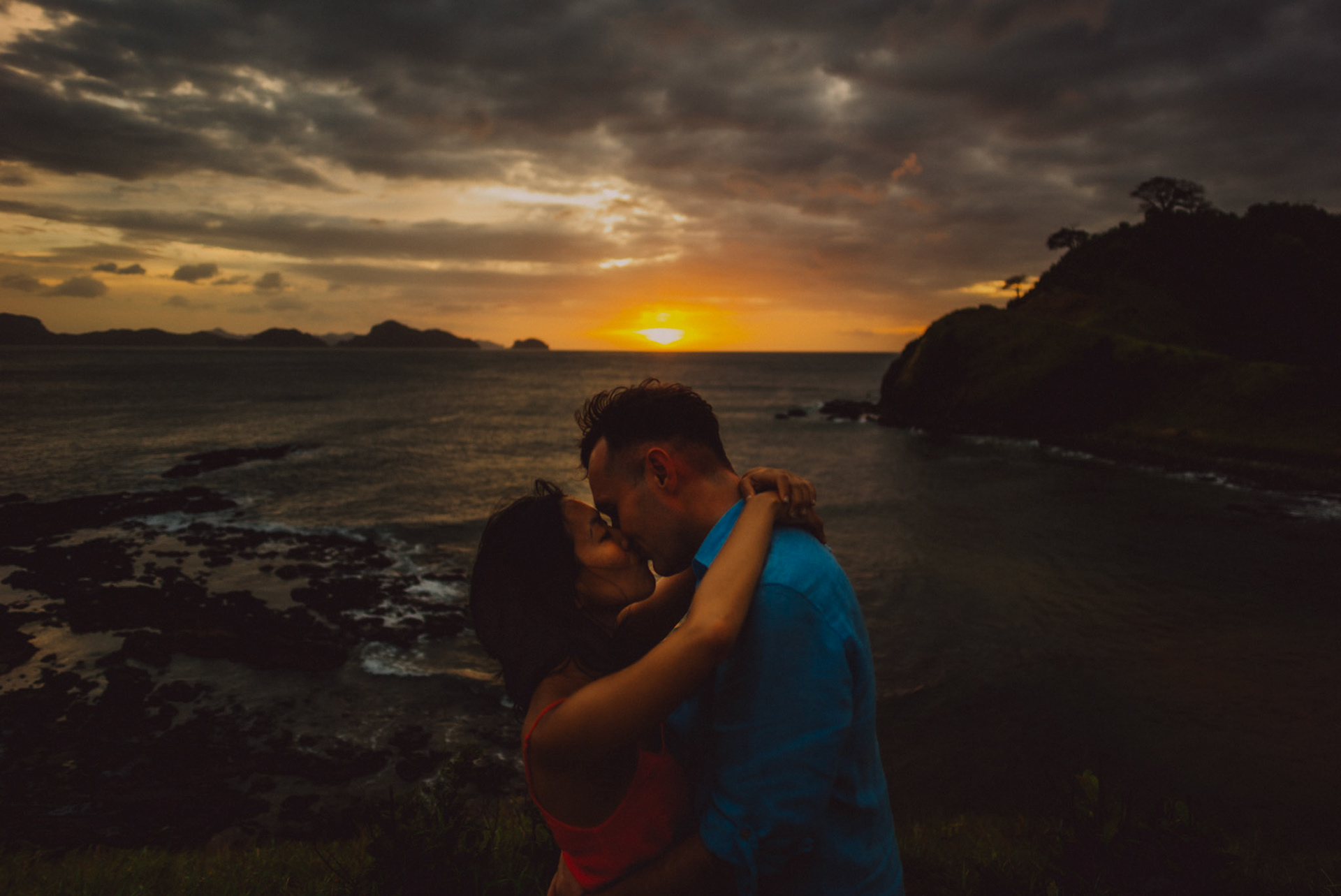 Moody sunset and blue hour couple portraits on a cliff overlooking El Nido Bay, Twin Beach beyond Nacpan, El Nido, Palawan, Philippines, Southeast Asia, January 2017, Leica M