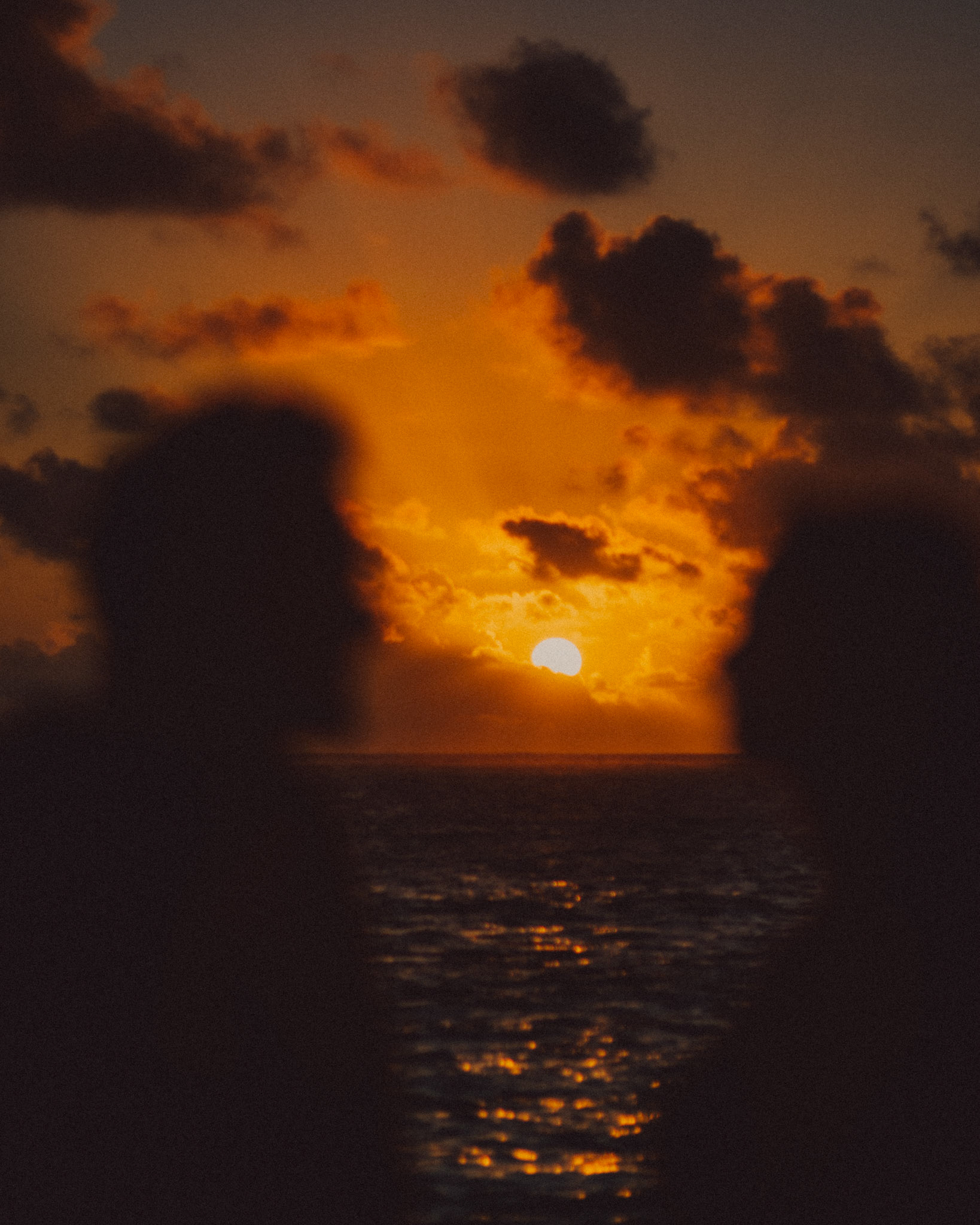 Moody sunrise couple silhouettes in General Luna, Siargao Island, Philippines, Southeast Asia, March 2019, Sony A7III.
