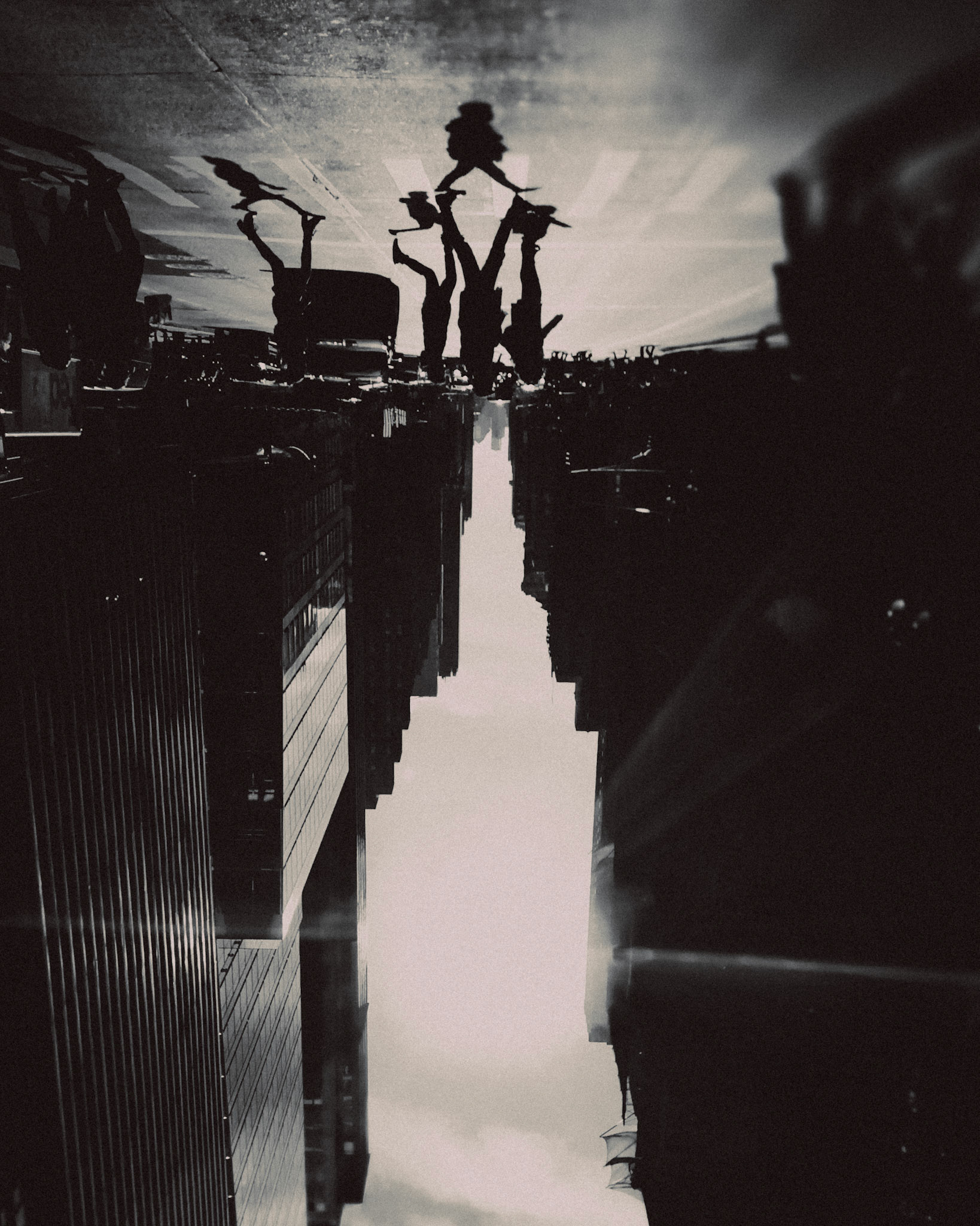 An upside down black and white photo of pedestrians, Midtown, Manhattan, New York City, USA, November 2017, Huawei Mate 9 Pro.