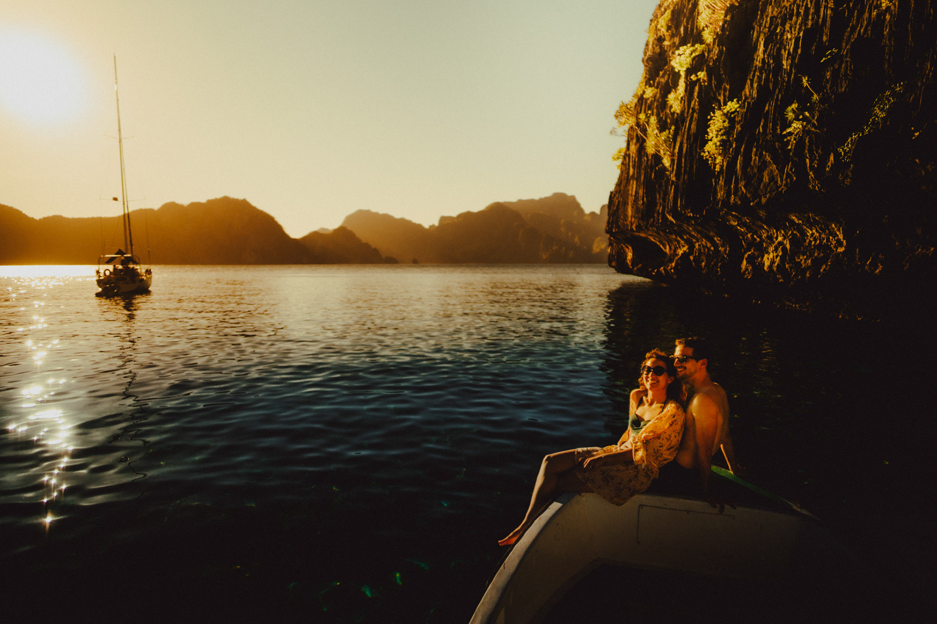 Chill adventure couple portraits in Entalula Island's secluded west-facing beach just moments before sunset, El Nido, Palawan, Philippines, Southeast Asia, April 2019, Sony A7III.