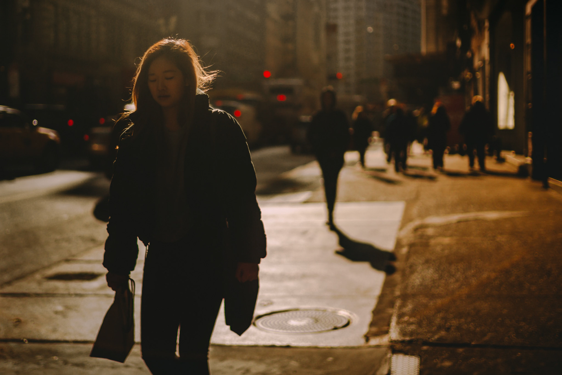 A woman walking in NoMad, Manhattan, New York City, USA, December 2017, Leica M.