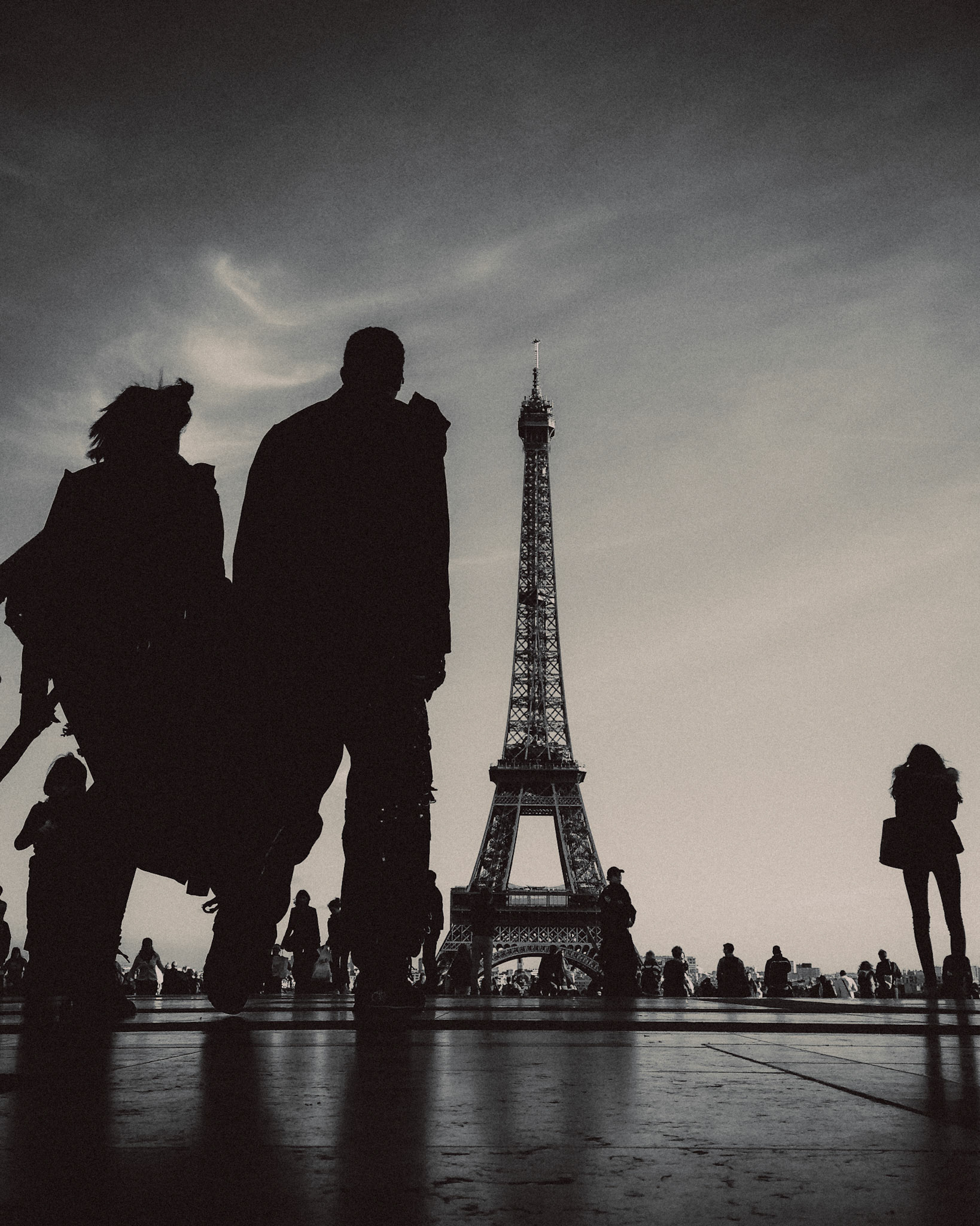 Two people walking towards the Eiffel Tower, Trocadéro, Paris, France, October 2013, Apple iPhone 5.