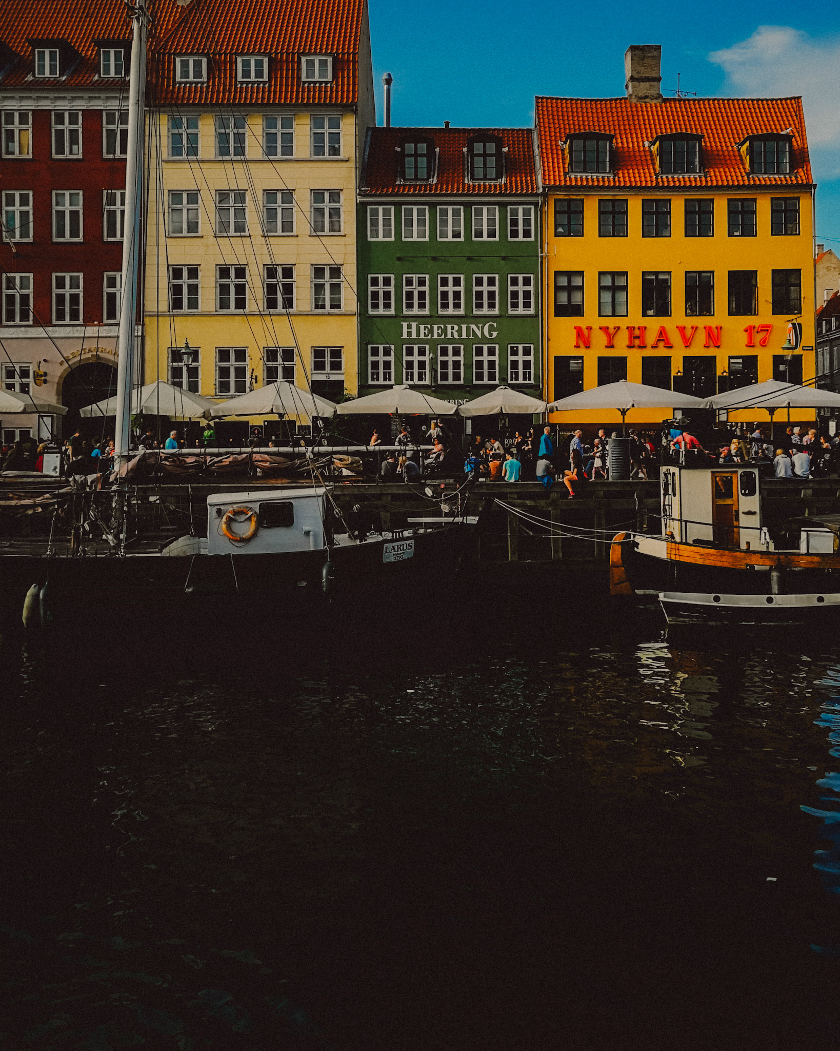 Colorful Danish houses and moored boats in Nyhavn, Copenhagen, Denmark, August 2017, Huawei P10 Plus.