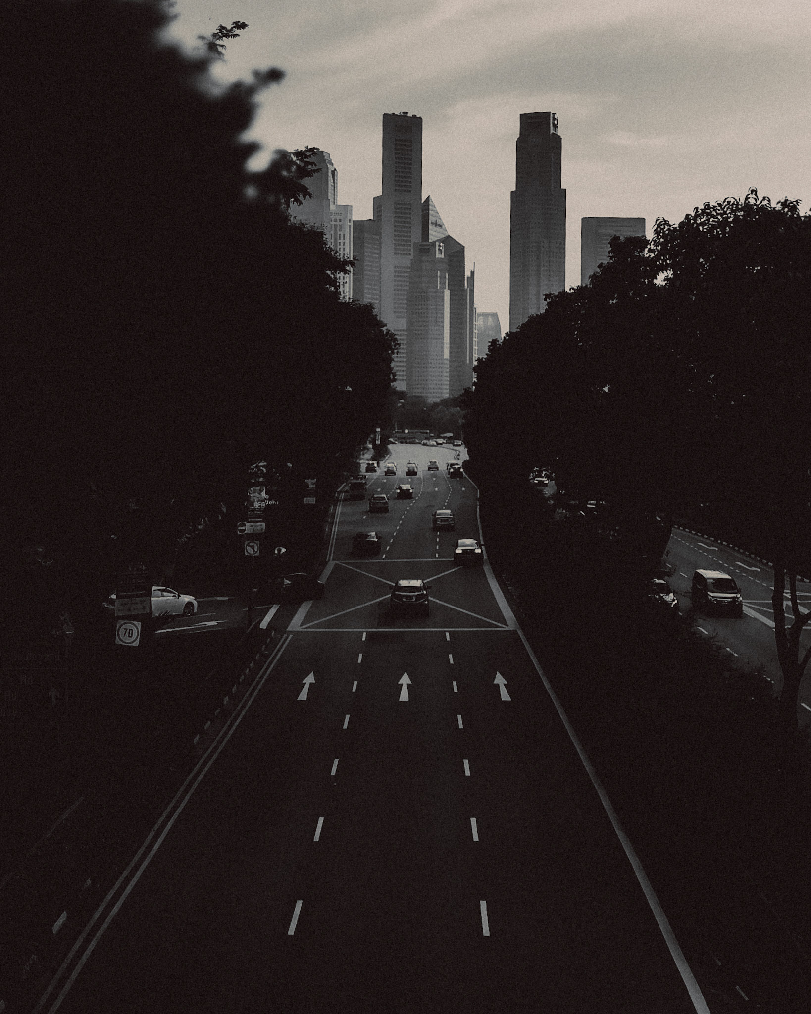 A high angle view of the Singapore CBD skyline from a pedestrian overpass in Nicoll Highway, in black and white, Singapore, November 2017, Huawei Mate 9 Pro.