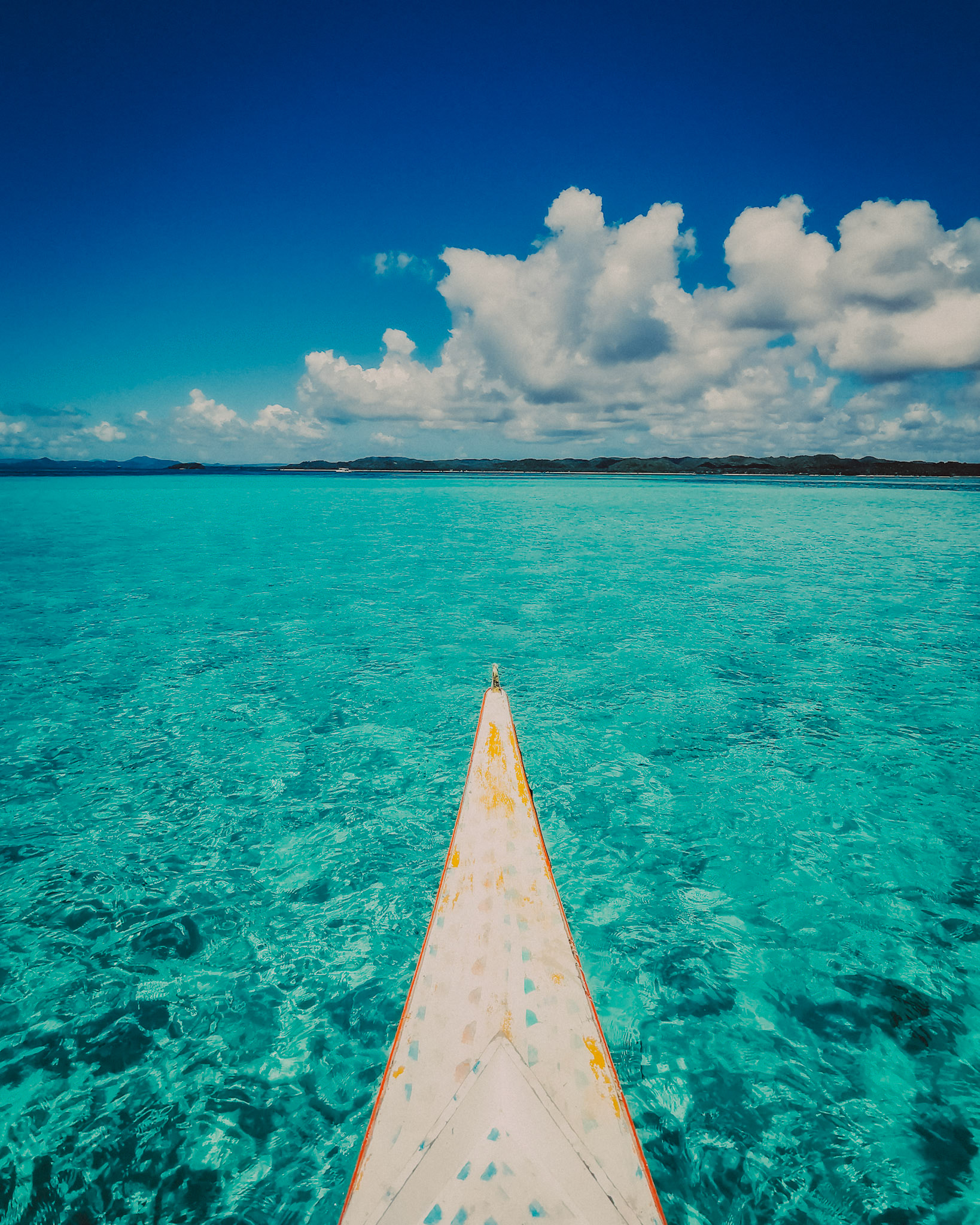 An outrigger boat's bow over Secret Sandbar at lowtide, Siargao Island, Philippines, March 2019, Huawei Mate 20 Pro.