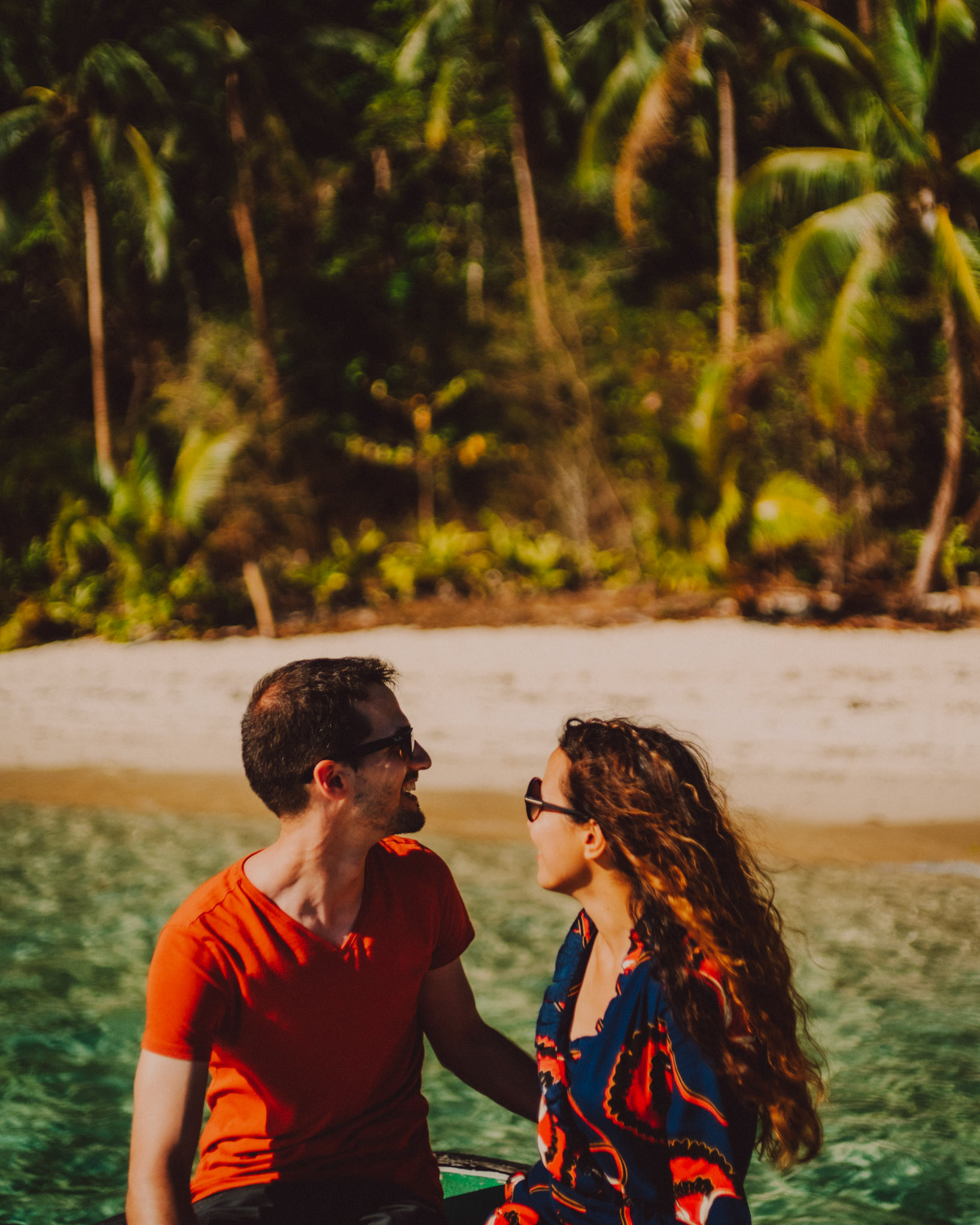 Couple portraits on a speedboat approaching Bukal Beach's idyllic cove, Cadlao Island, El Nido, Palawan, Philippines, Southeast Asia, April 2019, Sony A7III.