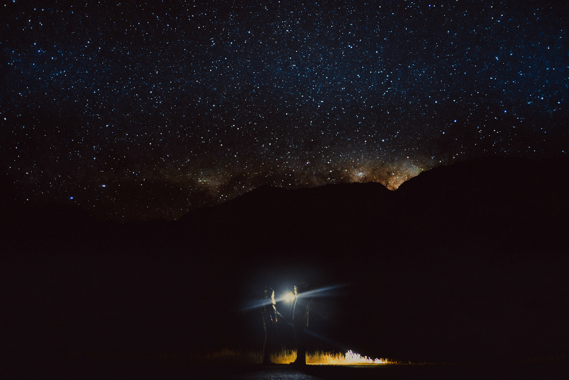 Starry night sky and milky way couple portraits in Aoraki Mount Cook Village, Canterbury, New Zealand, June 2017, Sony A7SII.