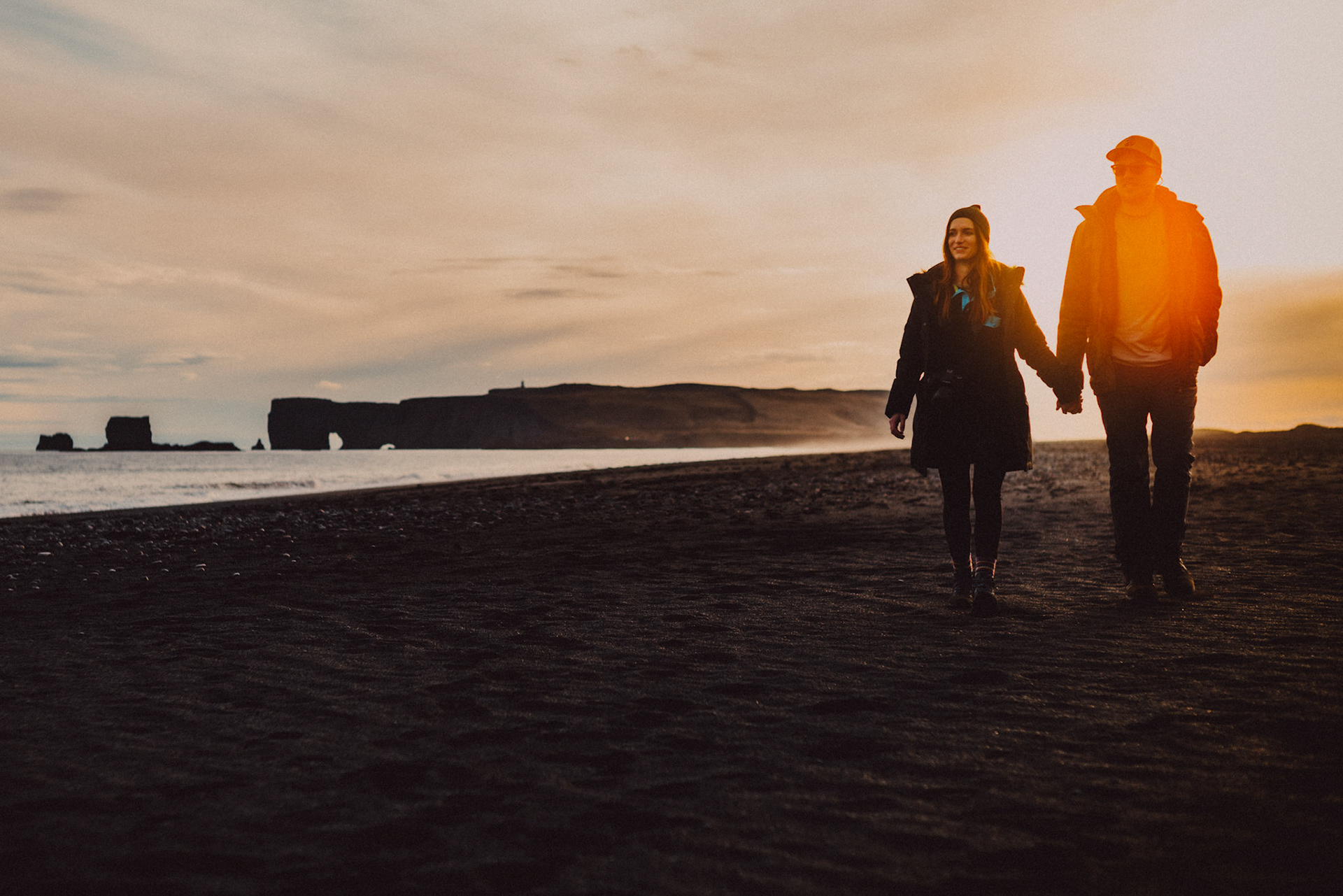 Sam &amp; Brooke, moody-toned candid adventure engagement portraits at the Reynisfjara black sand beach, Iceland, May 2016, Sony A7RII.