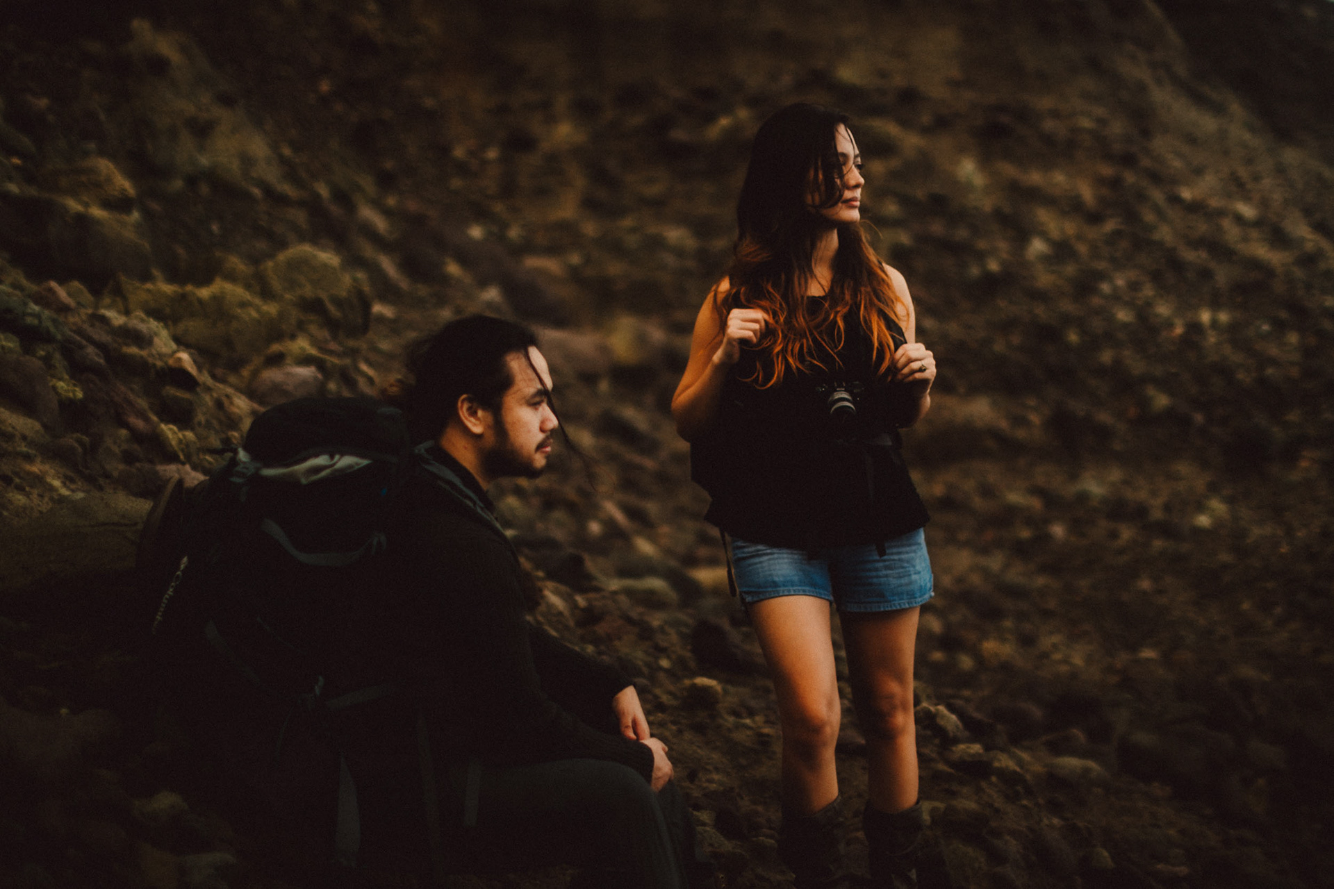 Moody backpacker couple portraits on a rocky cliff below Chawa View Deck in Mahatao, Batanes, Philippines, Southeast Asia, November 2014, Canon EOS 6D.