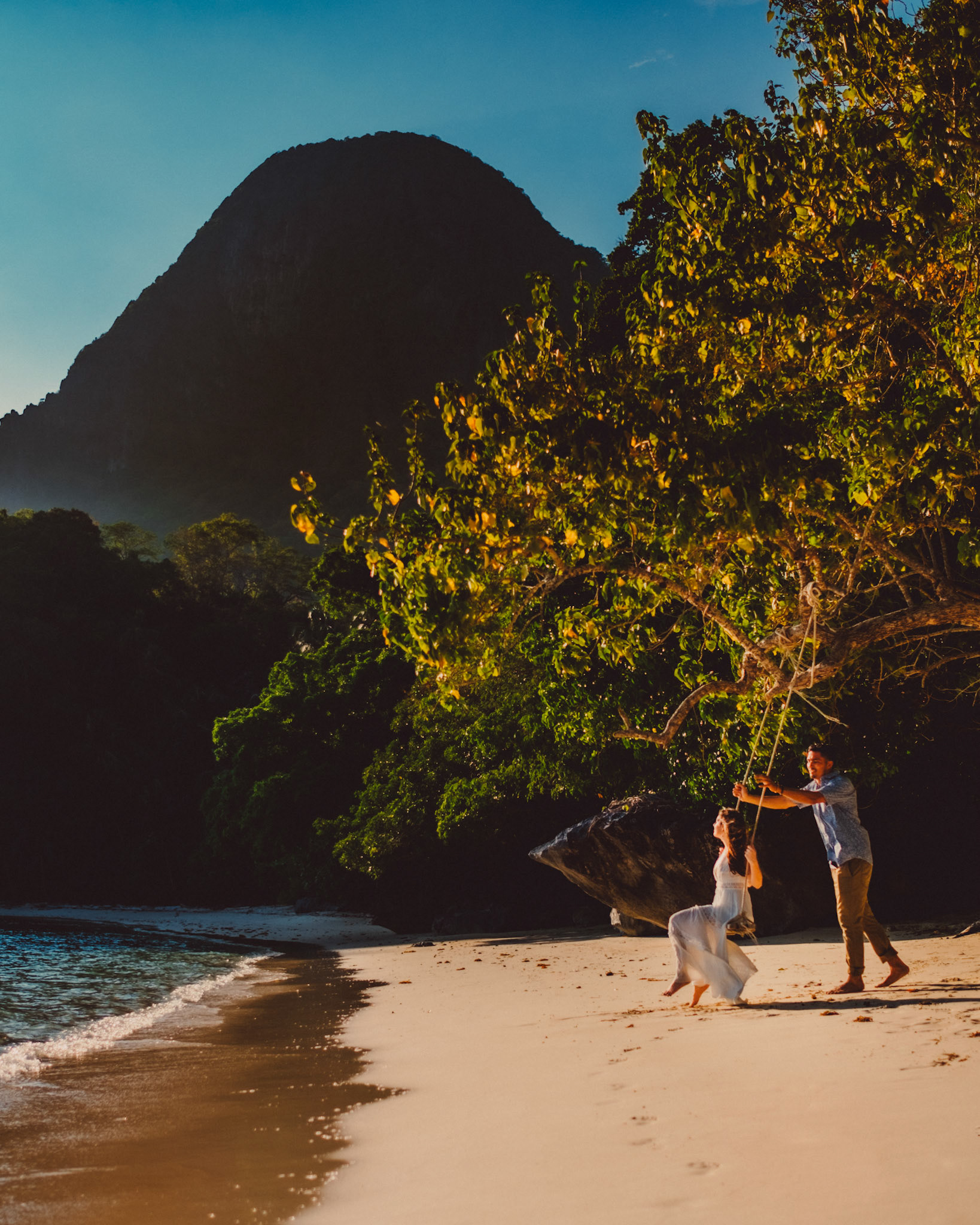 Couple portraits on a swing in Paradise Beach, Cadlao Island, from Peter &amp; Alexis' adventure pre wedding photo shoot in El Nido, Palawan, Philippines, Southeast Asia, April 2018, Fuji XH1
