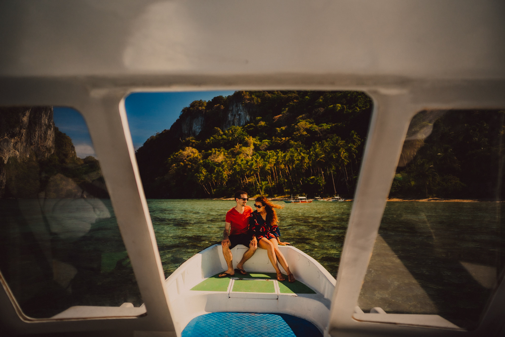 Couple portraits on a speedboat approaching Bukal Beach's idyllic cove, Cadlao Island, El Nido, Palawan, Philippines, Southeast Asia, April 2019, Sony A7III.