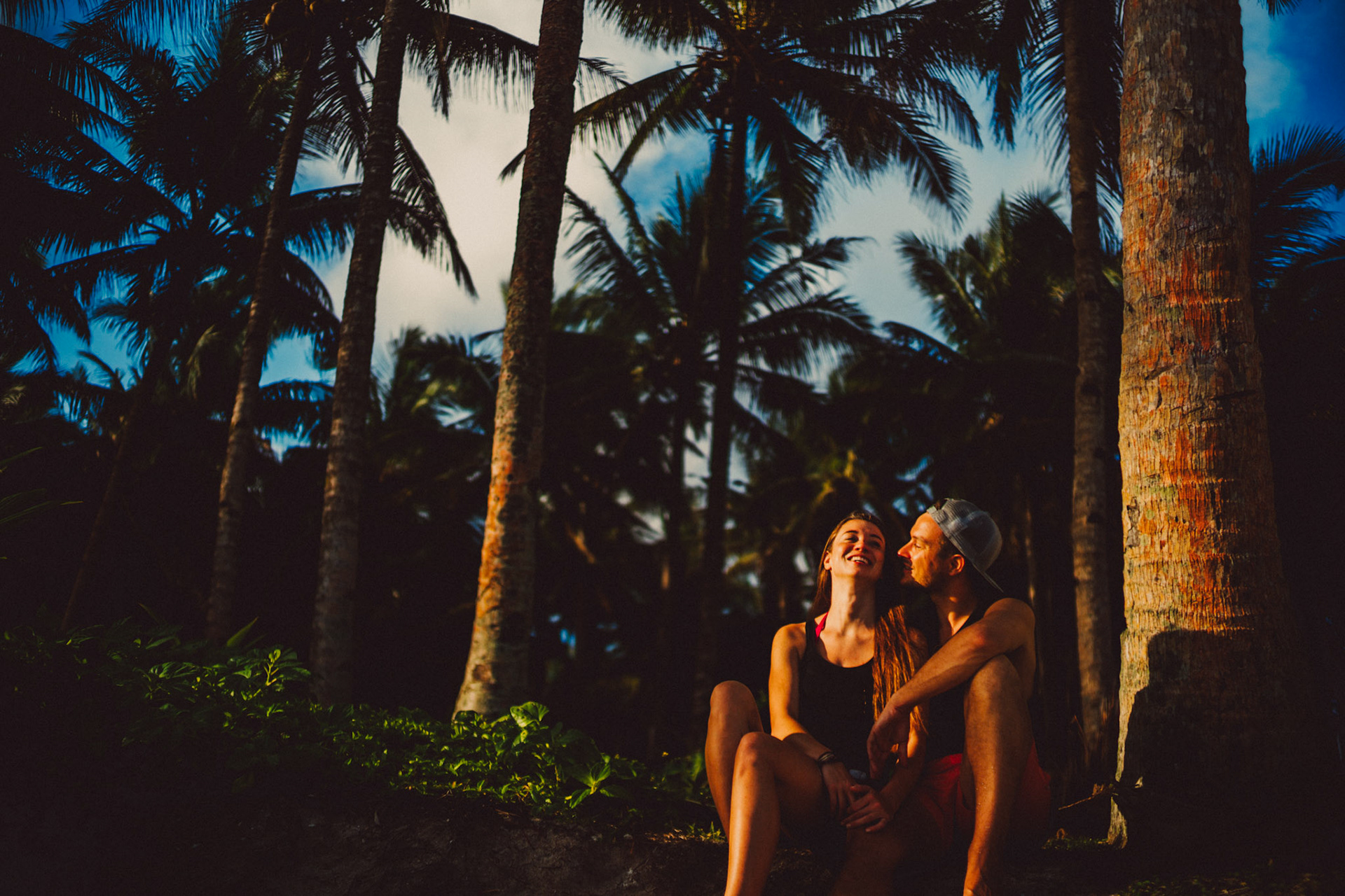 Chill and candid couple portraits by the beach, in between palm trees, Siargao Island, Philippines, Southeast Asia, March 2019, Sony A7III.