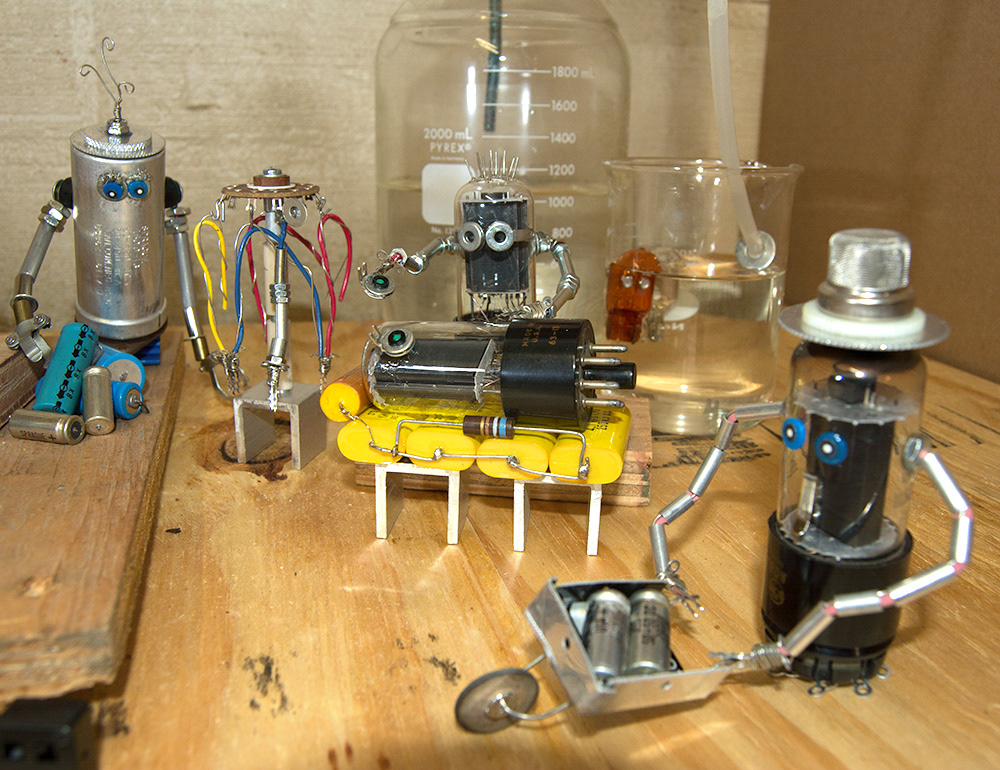 Assembly workers in electronics factory building new vacuum tube person