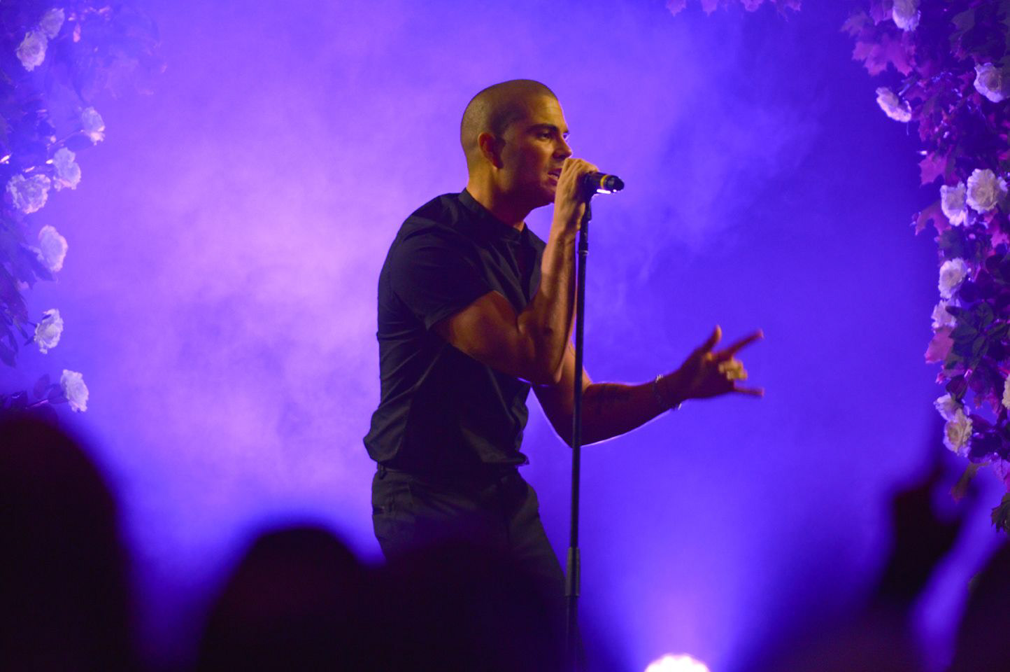 lindsey ahmet graphic designer and photographer runway photography of max george from the wanted singing on stage