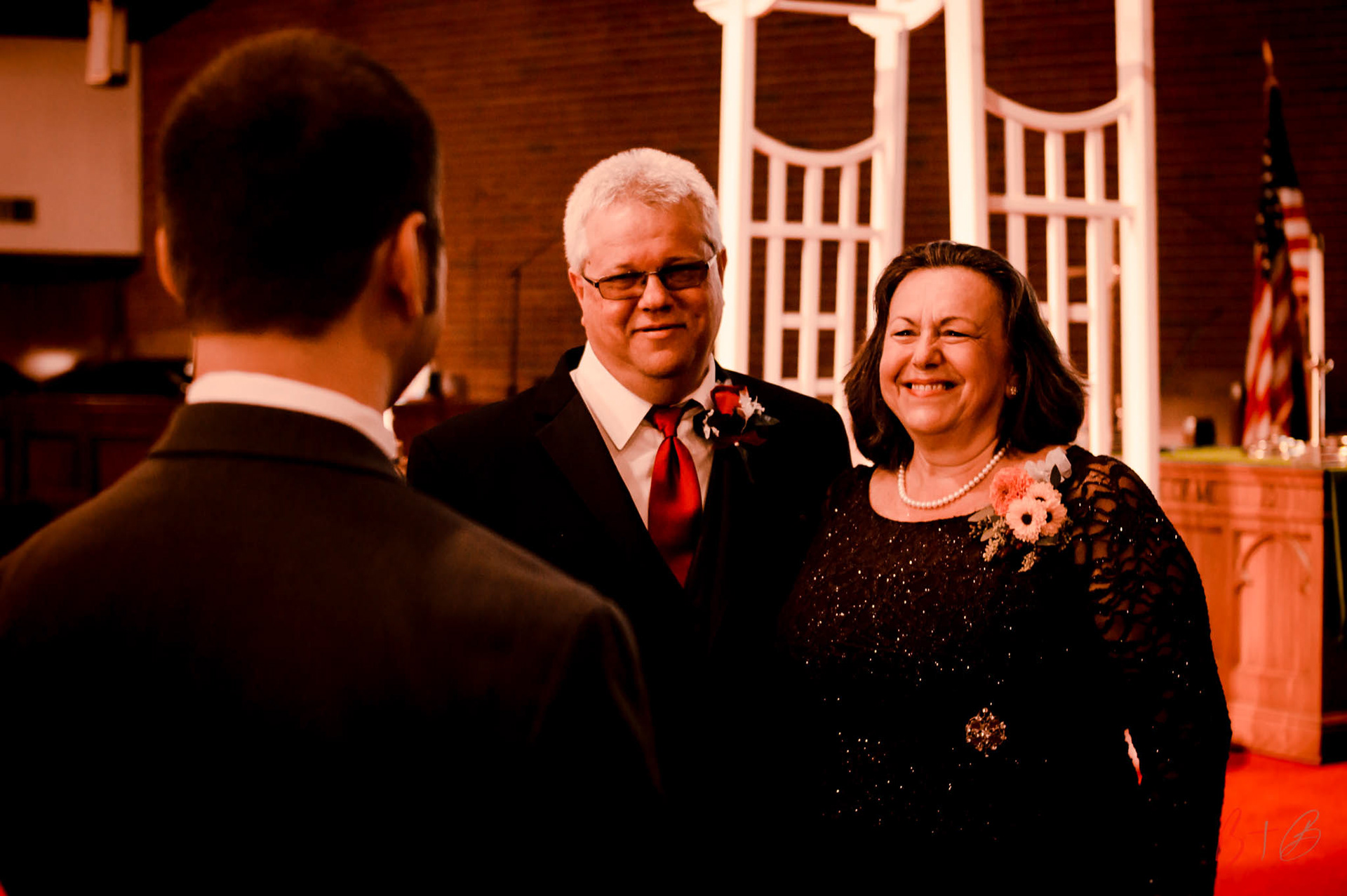 Smiling parents, proud that the day has come.