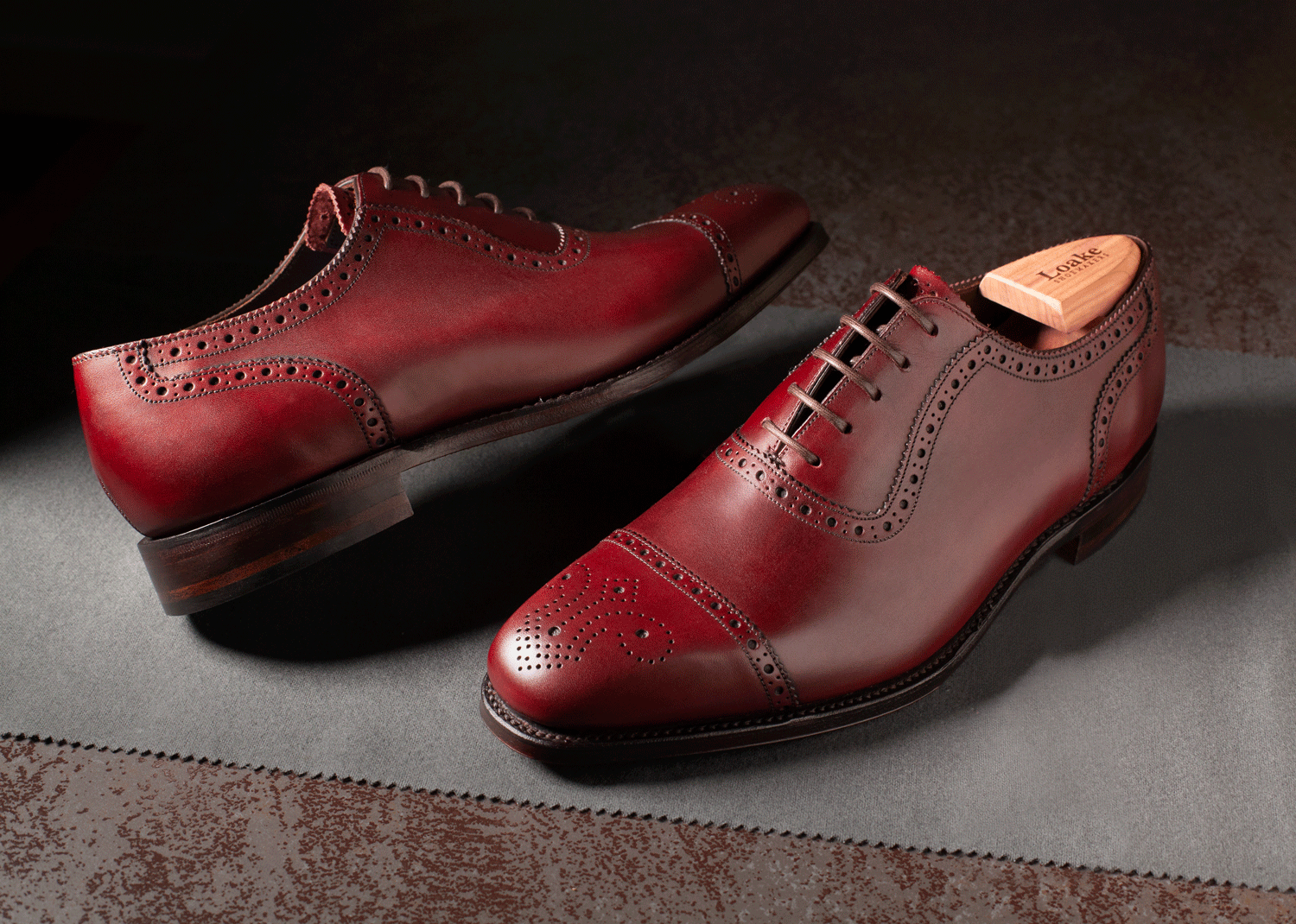 Lifestyle image of quality leather shoes Loake 1880 in burgundy by © Stefania Calderara