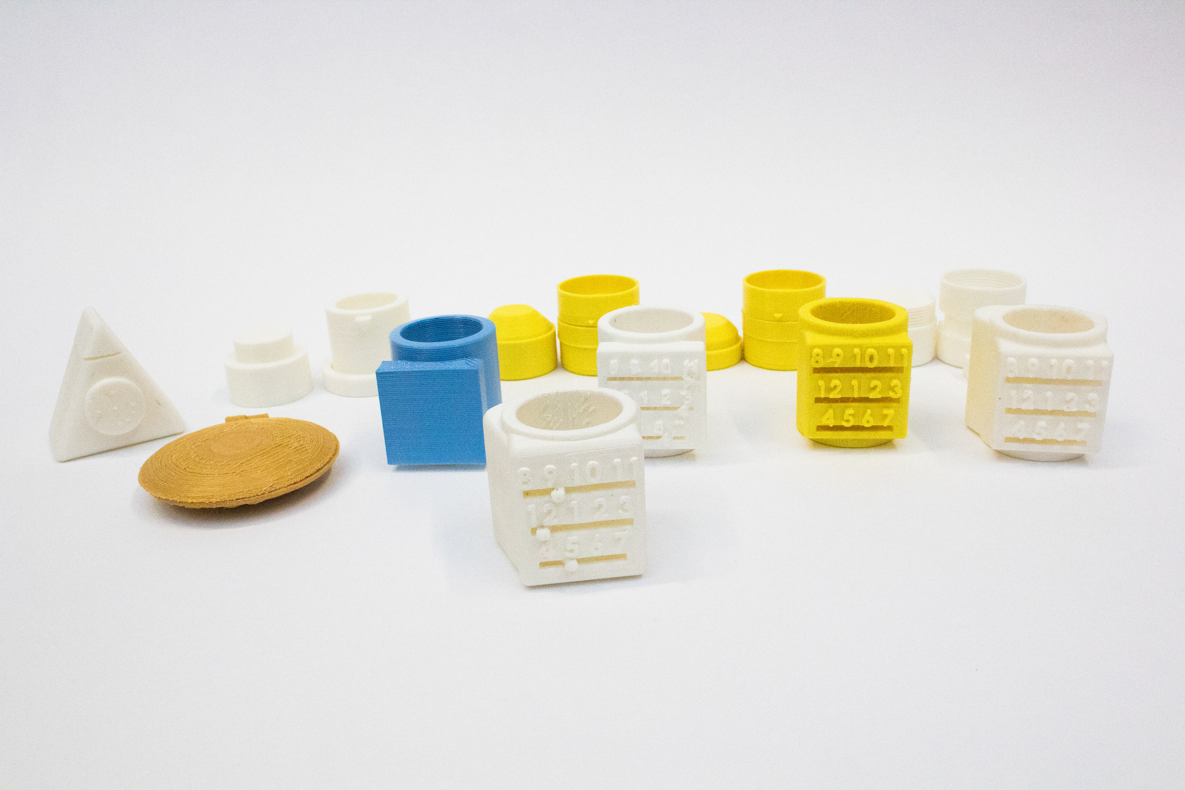 A collection of 3D printed medication aides.