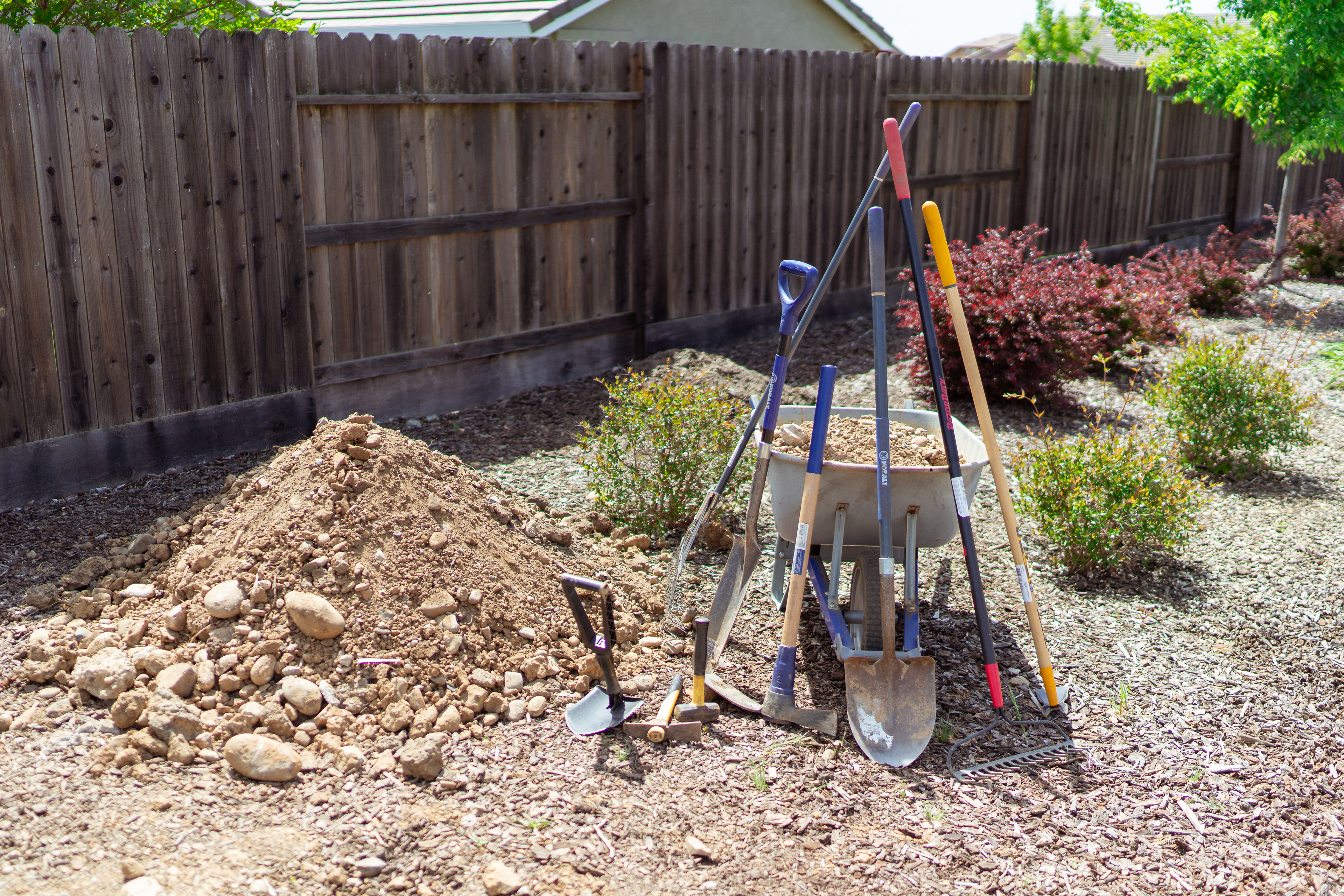 Aftermath... not pictured are the two heaping wheelbarrows of those big boulders that my neighbor hauled away to his rock garden already...