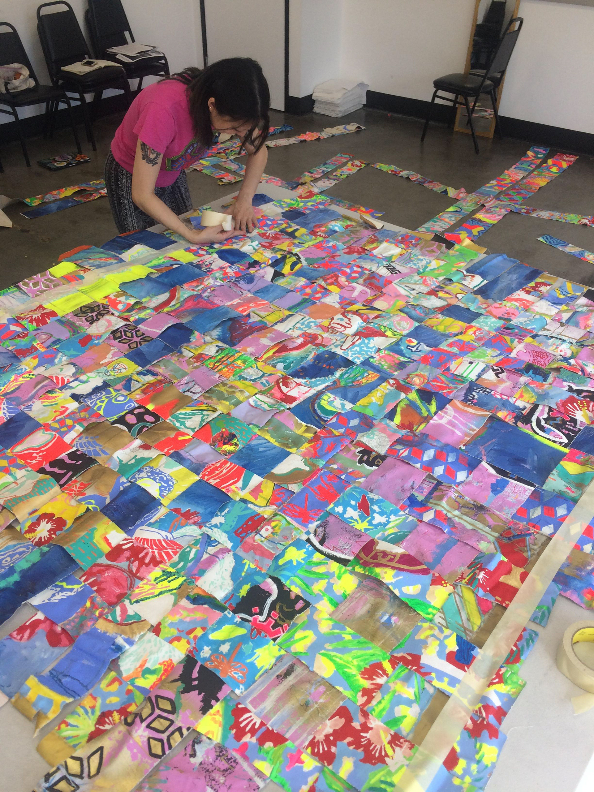 Amy prepares the canvas quilt for me and her to sew.