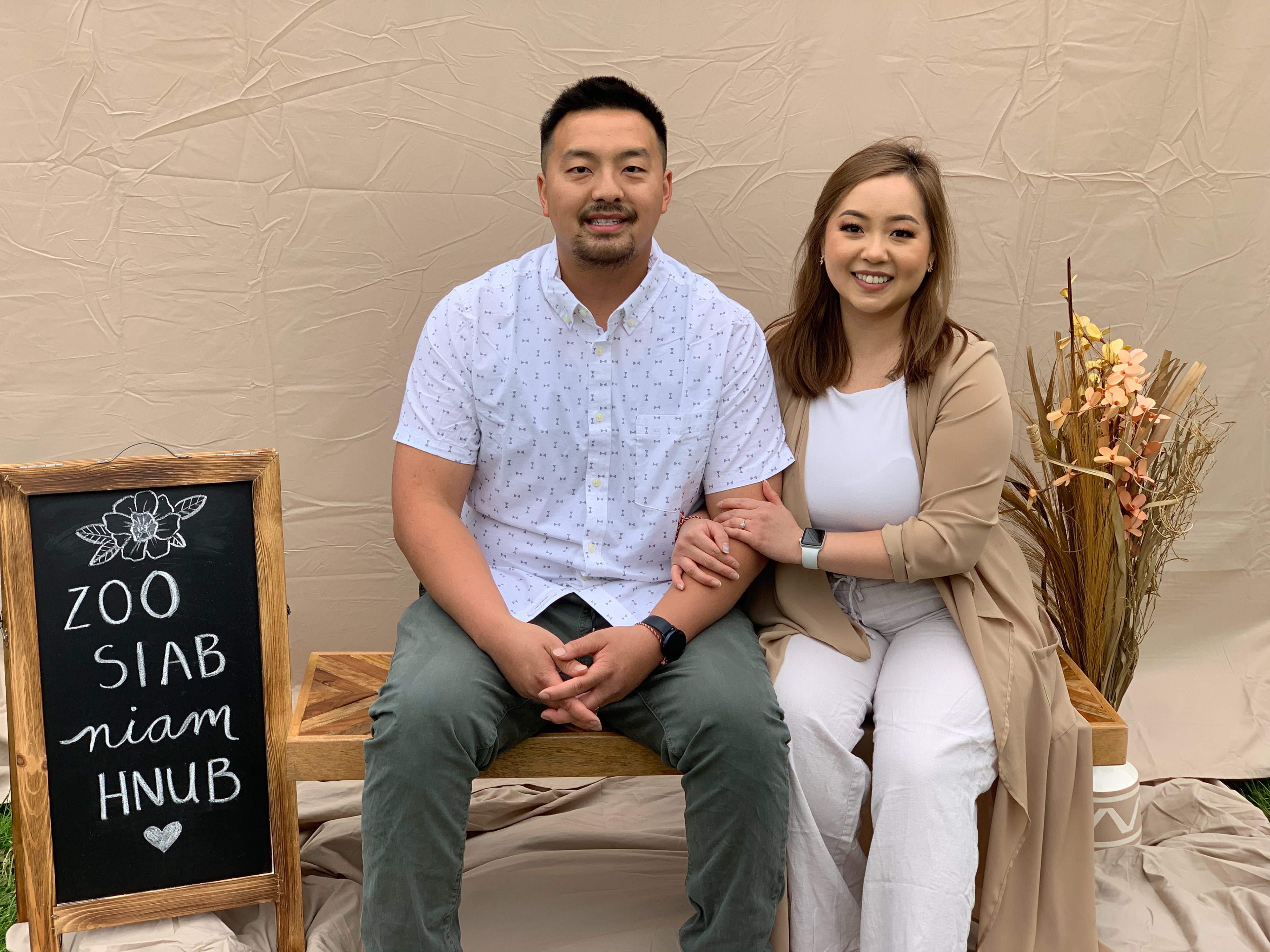 My partner, Stephen and I posing with a simple beige backdrop I created for Mother's Day. Psstt! I used bedsheets 🤫