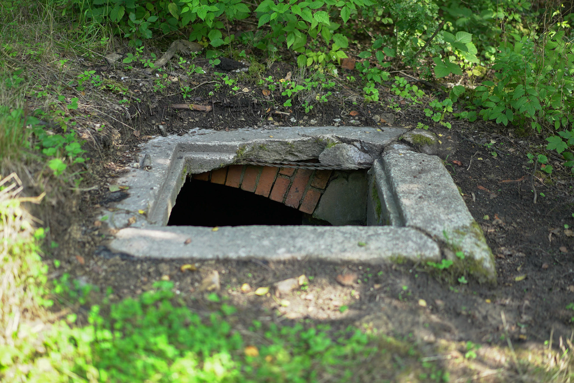 A waste receptacle from the original camp