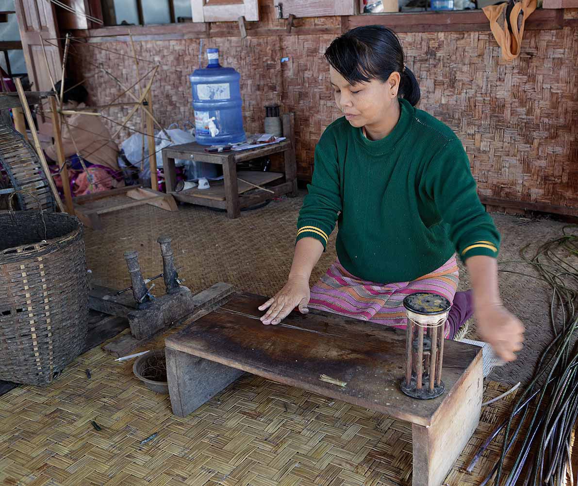 Extracting thread from Lotus stems, Khon Village