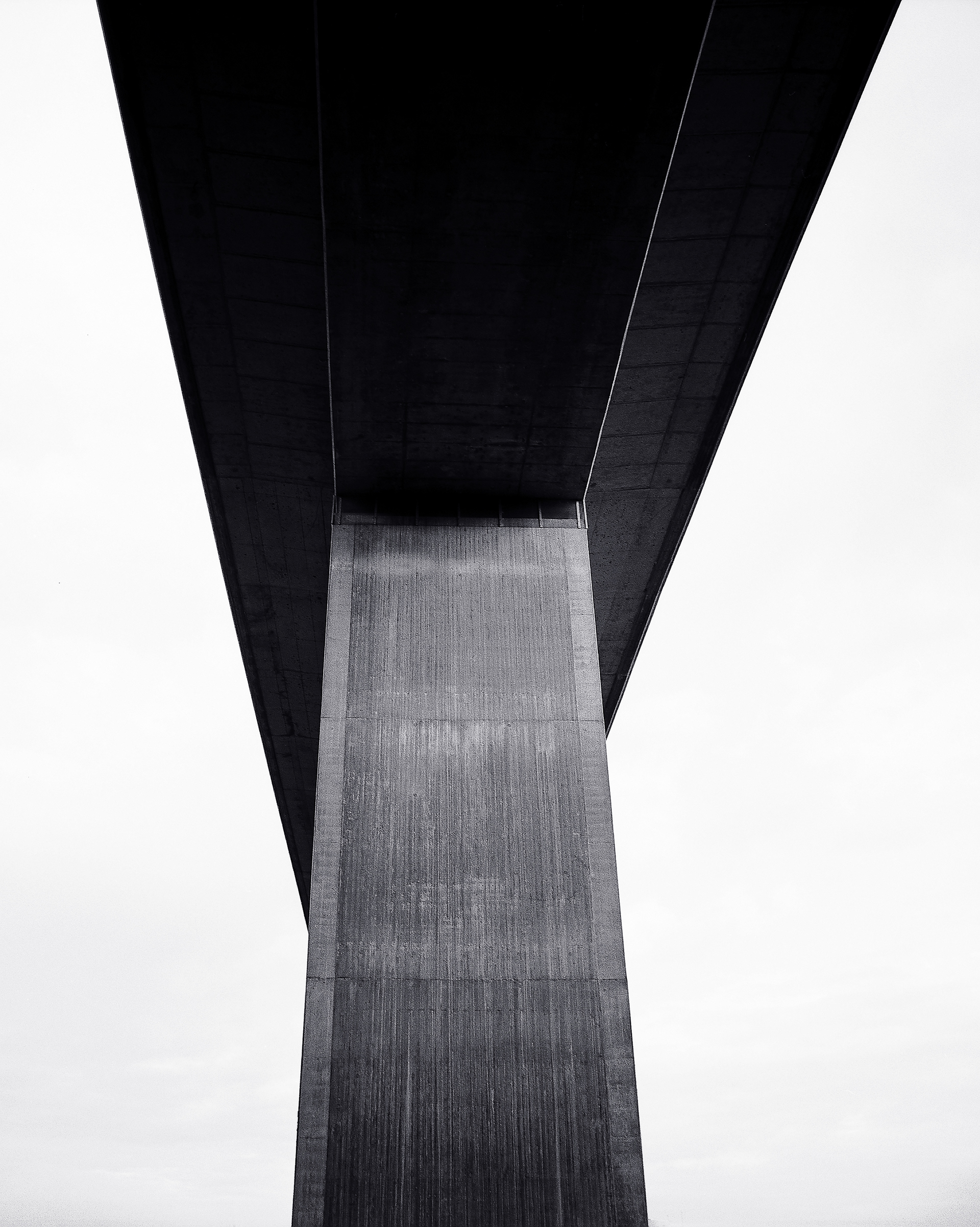 Graphic view of a bridge underpass in black and white