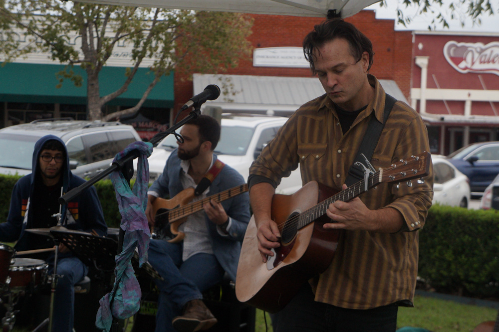 Tanner Swain of the Trio Del Rio band plays his guitar. He and his wife, MariLisa, are local to the area.