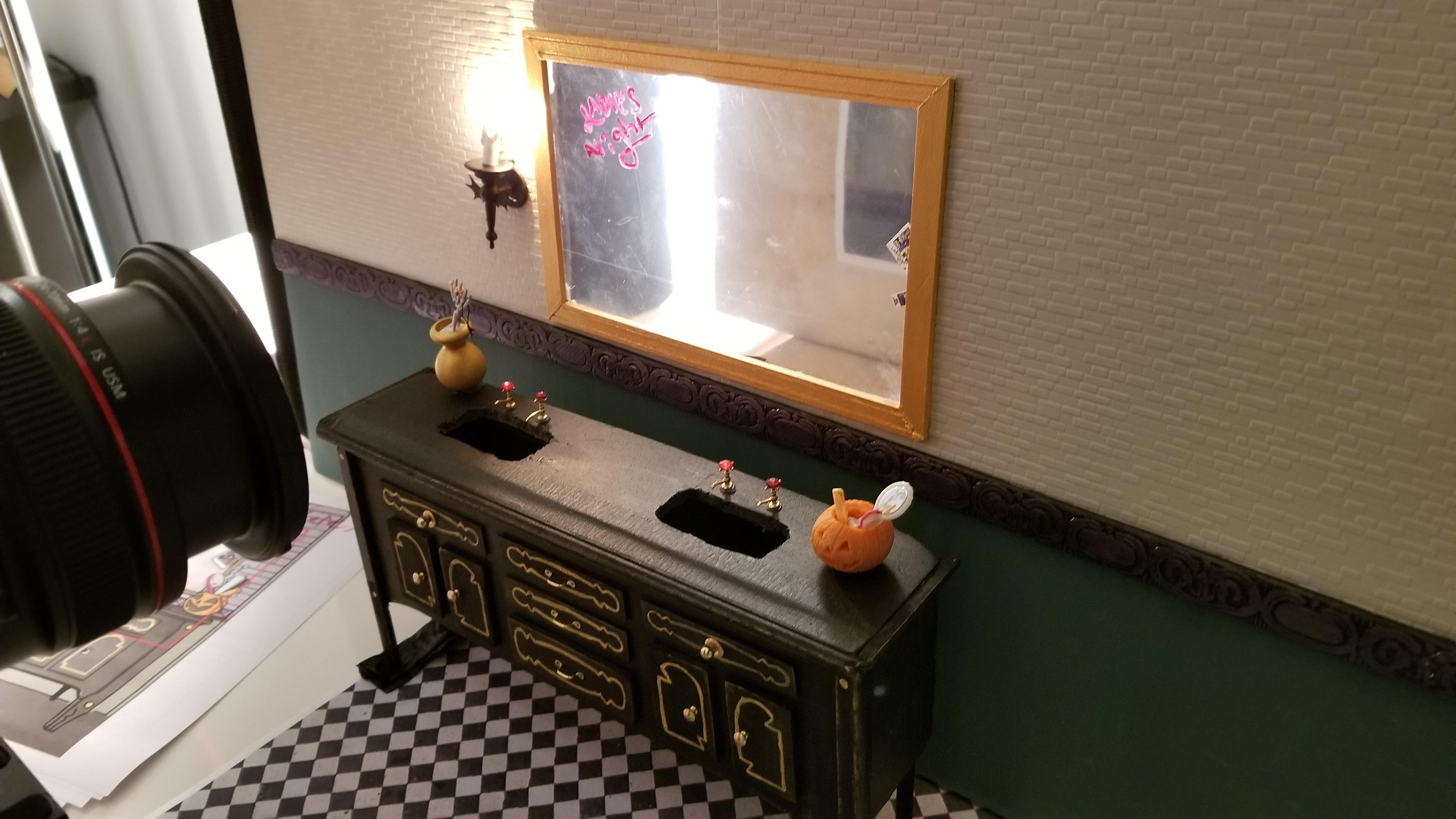 This mirror isn't actually a mirror at all. To shoot directly into a "mirror" we used plastic and an out of focus print.
