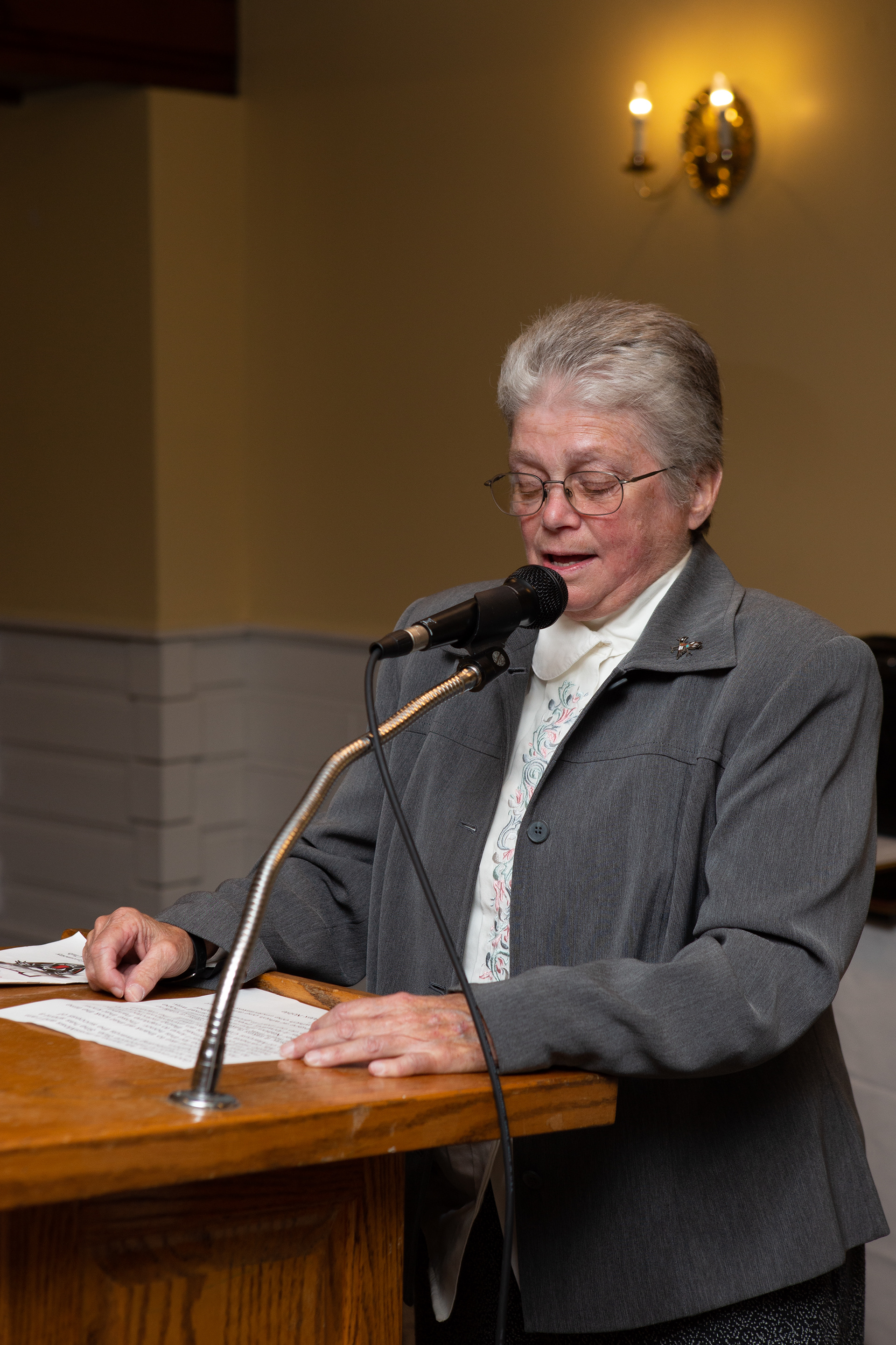 Sue Moss accepts her award and induction as one of Whitman-Hanson Regional high school's first inductees in to the newly founded Athletic Hall of Fame. Photo by Austin Schofield