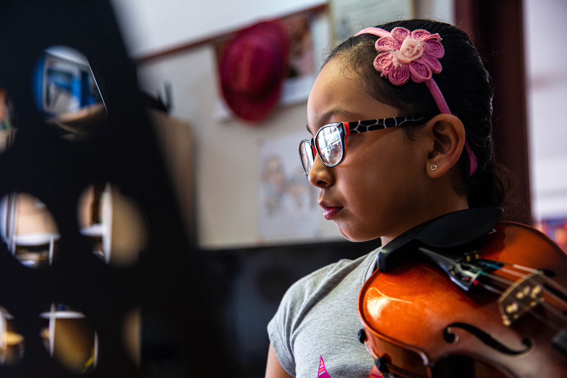 Angie Moreno practices violin before and after school.