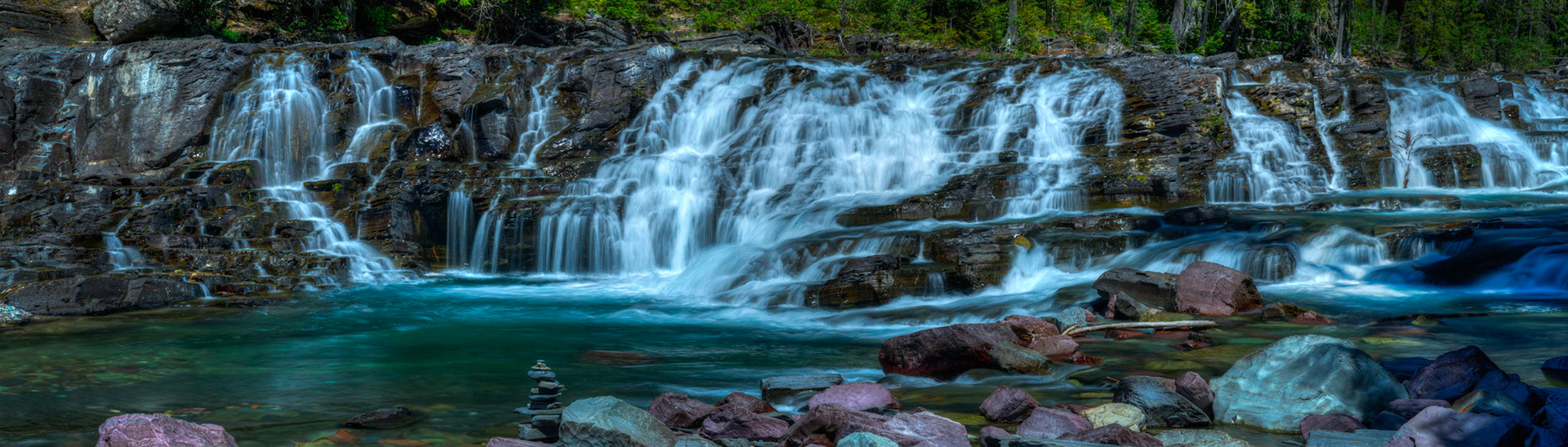 Unnamed cascades on McDonald Creek, just upstream of Lake McDonald.Glacier National ParkJuly 31, 2015This is an HDR panoramic image consisting of 8 frames comprised of 5 exposures each. HDR processing performed in Photomatix Pro.  Panoramic stitching performed in Photoshop. Additional processing performed in Lightroom and Photoshop.PENTAX K-3, Sigma 18-250mm f/3.5-6.3 DC OS HSMISO 100 78 mm  0.4 sec at ƒ / 22