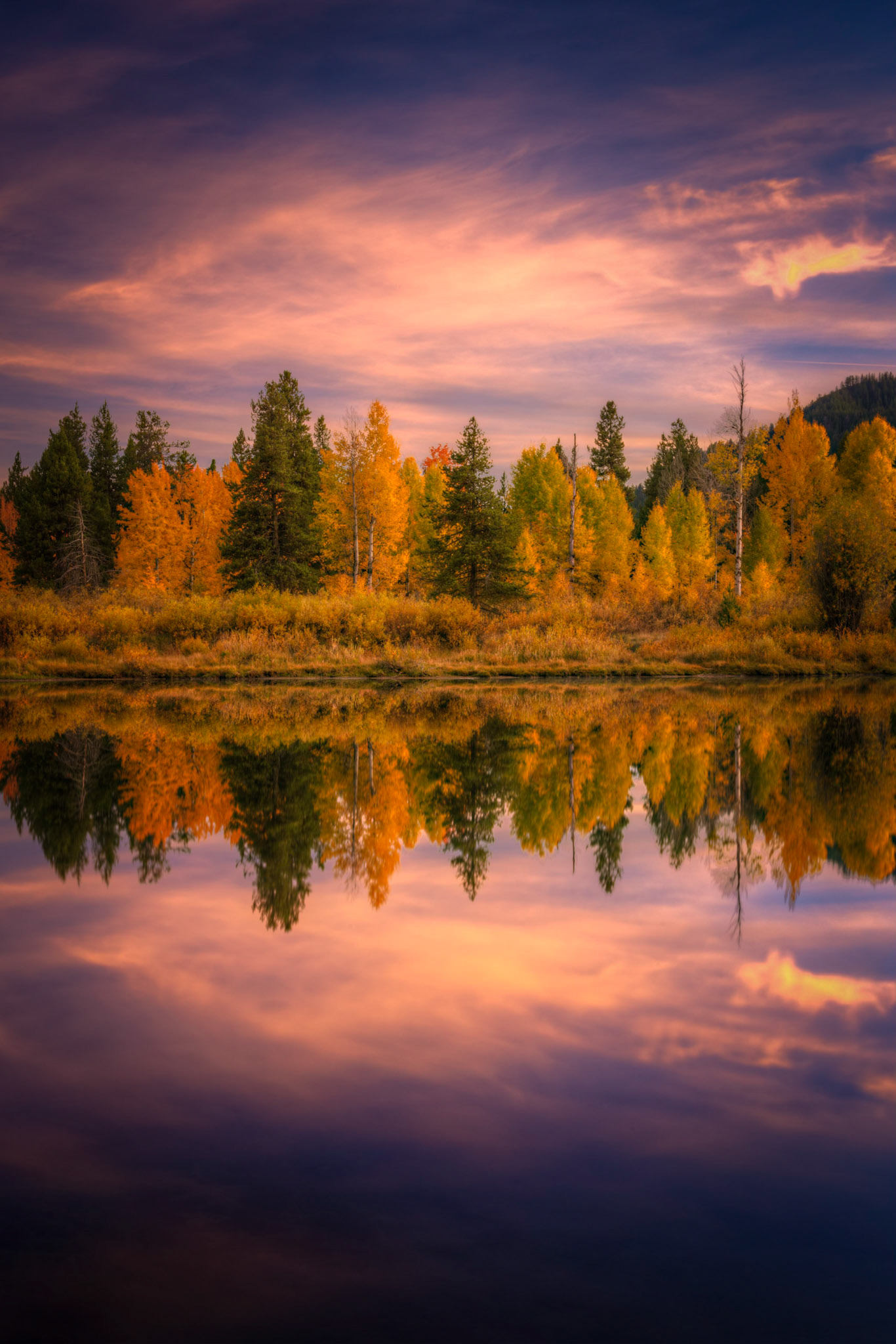 Reflections of the autumn colors on the Snake River.Grand Teton National ParkWyomingSeptember 26, 2016This is an HDR image consisting of 5 exposures merged in Photomatix Pro. Additional processing in Lightroom and Photoshop.PENTAX K-1, TAMRON 28-300mm F3.5-6.3 Ultra zoom XRISO 100 45 mm  5.0 sec at ƒ / 18