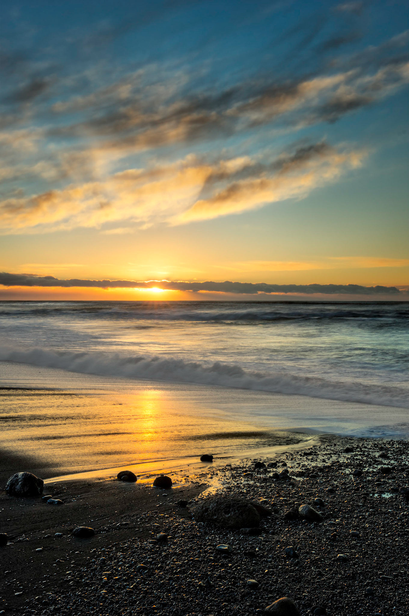 Sunrise on the black sand beach at the village of Vík í Mýrdal.  This is the southernmost settlement in all of Iceland.Vík, Suðerland, IcelandFebruary 9, 2016This is an HDR image consisting of 5 exposures merged in Photomatix Pro. Additional processing in Lightroom and Photoshop.PENTAX K-3, Sigma 18-35mm f/1.8 DC HSM ArtISO 100 28 mm  ¹⁄₁₀ sec at ƒ / 16