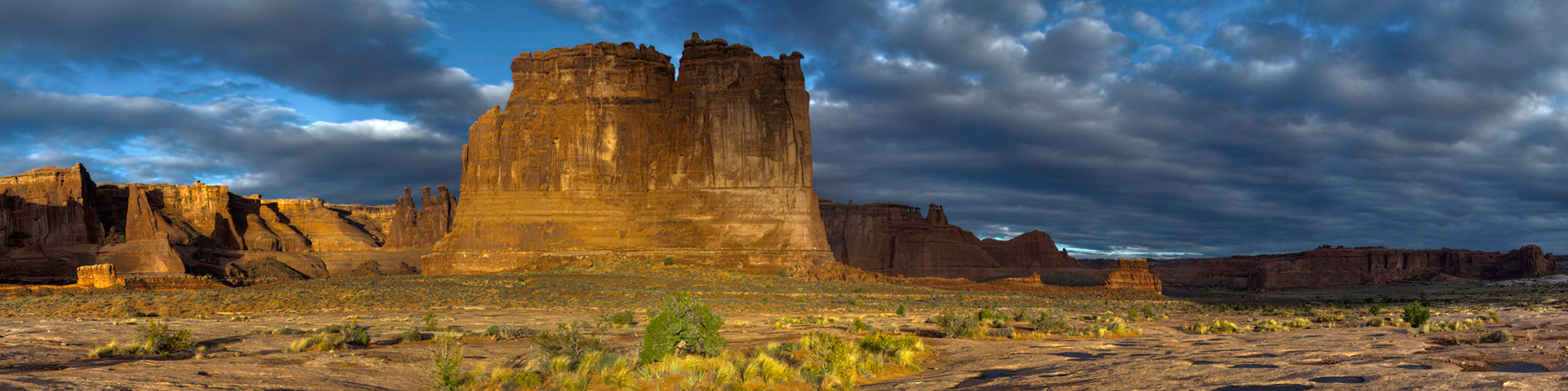 Shortly after sunrise at the Courthouse Towers.Arches National Park3 November 2014This is an HDR panoramic image consisting of 6 frames comprised of 5 exposures each. HDR processing performed in Photomatix Pro.  Panoramic stitching performed in Photoshop. Additional processing performed in Lightroom and Photoshop.PENTAX K-3, Sigma 18-250mm f/3.5-6.3 DC OS HSMISO 100 18 mm  ¹⁄₅₀ sec at ƒ / 11Prints of my work are available from my website at http://www.fingolfinphoto.comFollow me on Facebook at http://www.facebook.com/fingolfinphoto or http://www.facebook.com/pesterleAlso, http://500px.com/pesterle   http://www.flickr.com/photos/fingolfinphoto