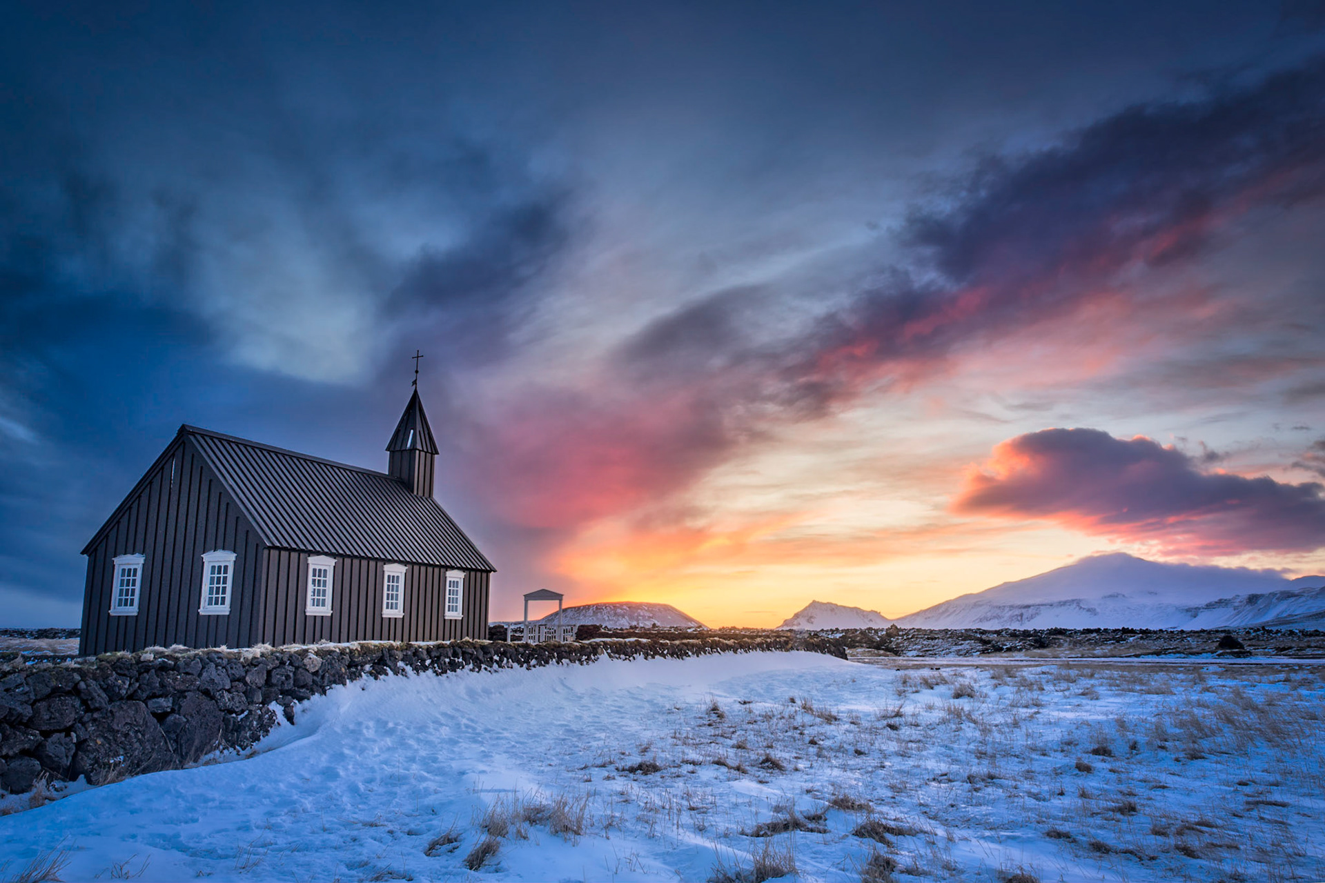 The Black Church of Búðir, Búðirkirkja.  In the distance is the stratovolcano Snæfellsjökull.Vesturland, IcelandFebruary 6, 2016This is an HDR image consisting of 5 exposures merged in Photomatix Pro. Additional processing in Lightroom and Photoshop.PENTAX K-3, Sigma 10-20mm f/4-5.6 EX DCISO 100 17 mm  0.3 sec at ƒ / 16