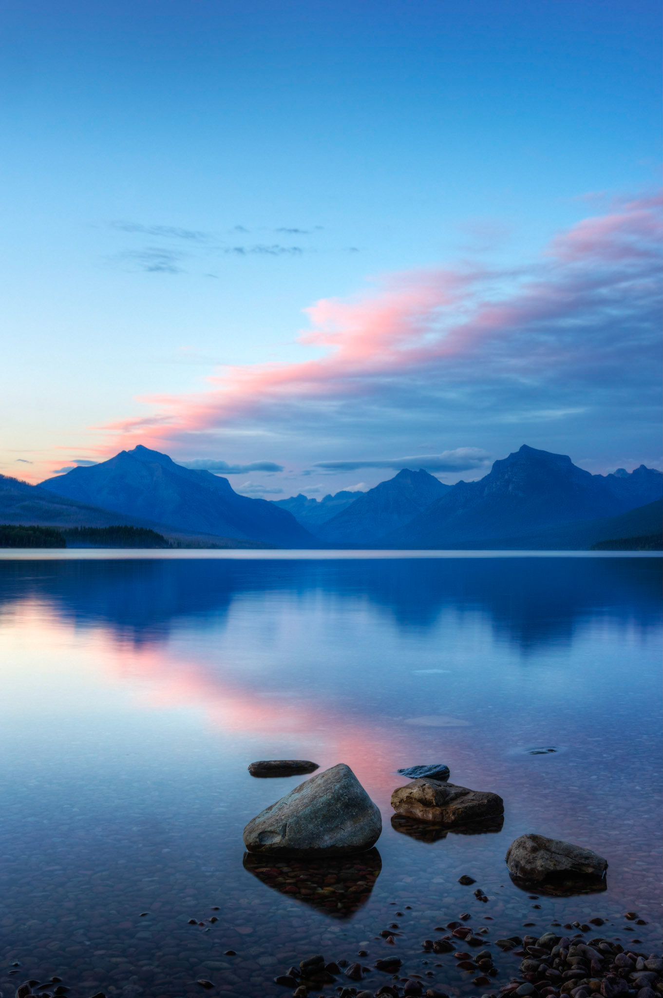 Sunset at Lake McDonald.Glacier National ParkJuly 26, 2015This is an HDR image consisting of 5 exposures merged in Photomatix Pro. Additional processing in Lightroom and Photoshop.PENTAX K-3, Sigma 18-35mm f/1.8 DC HSM ArtISO 100 26 mm  1.0 sec at ƒ / 11