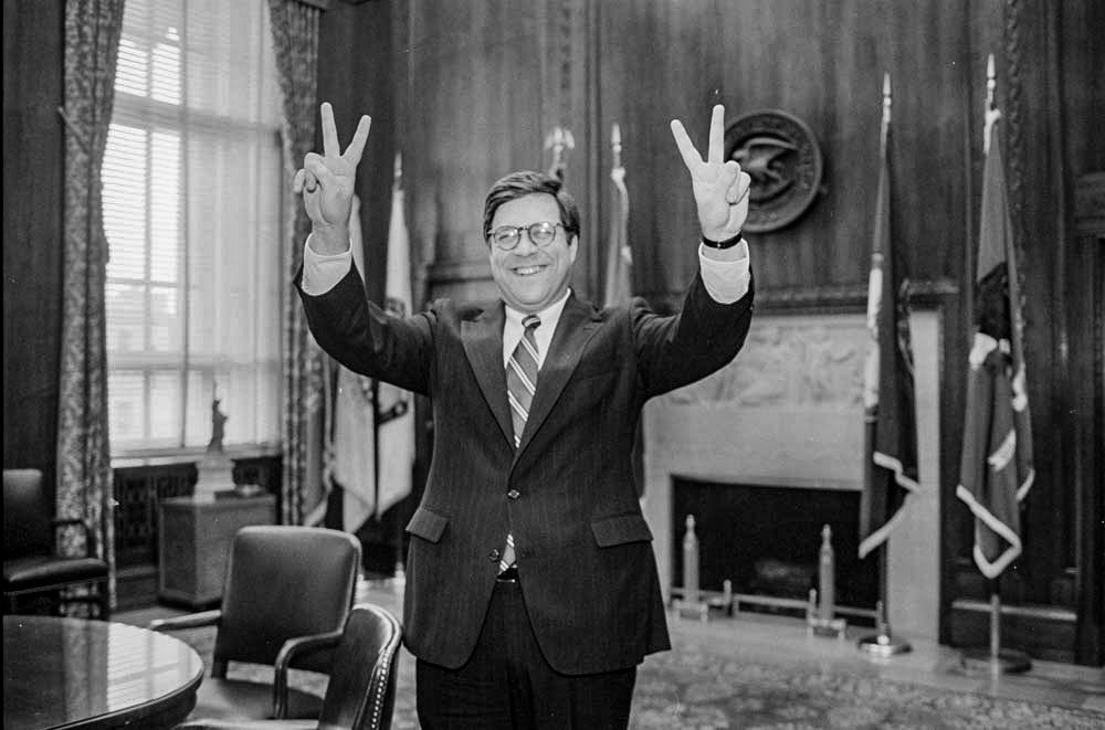 Newly appointed Attorney General William Barr shows his impression of Richard Nixon during a photo session, February 12, 1992