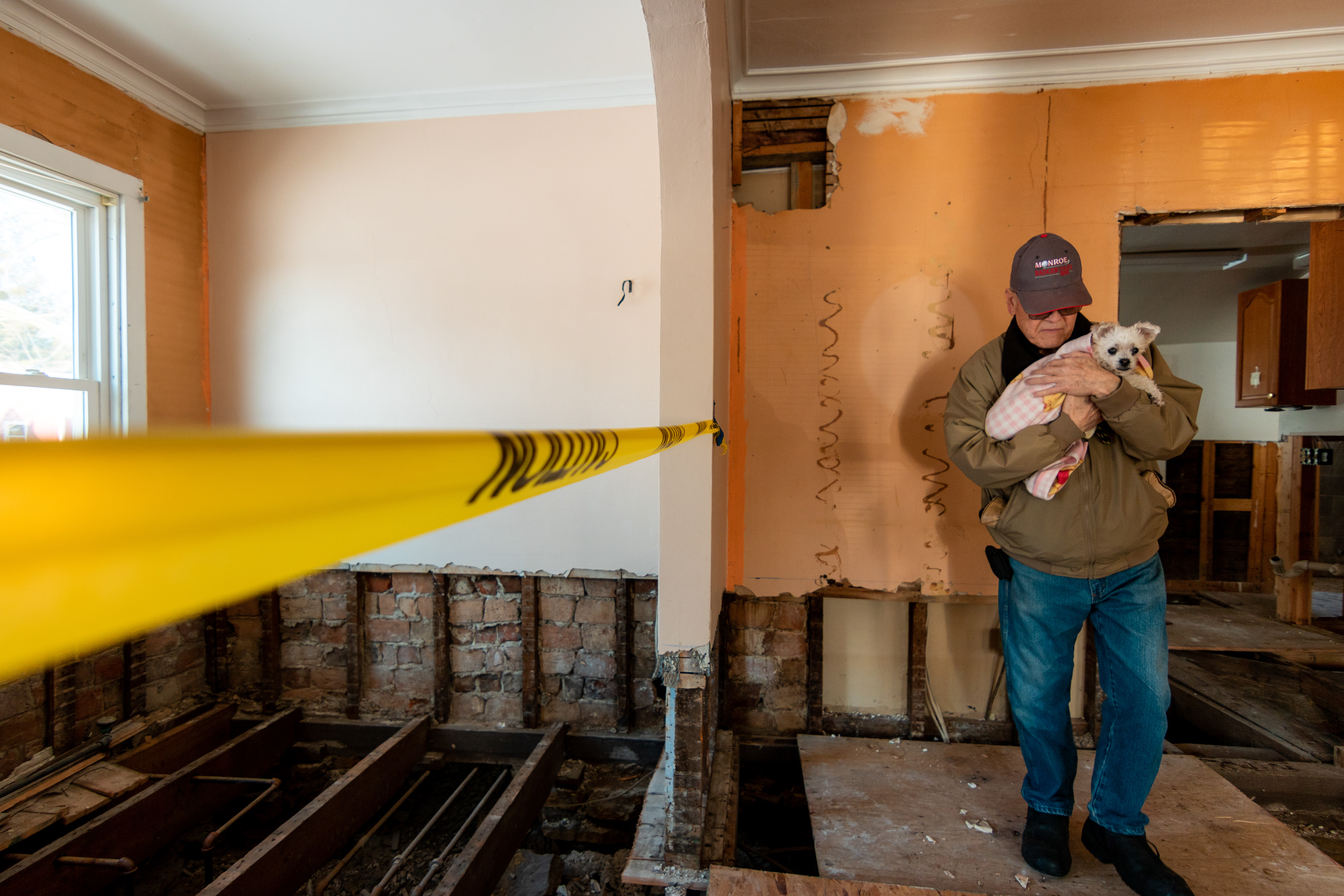 Bob Dublin and his dog, Mandie, stand in his house exactly 6 months after historic Mazomanie flooding destroyed it