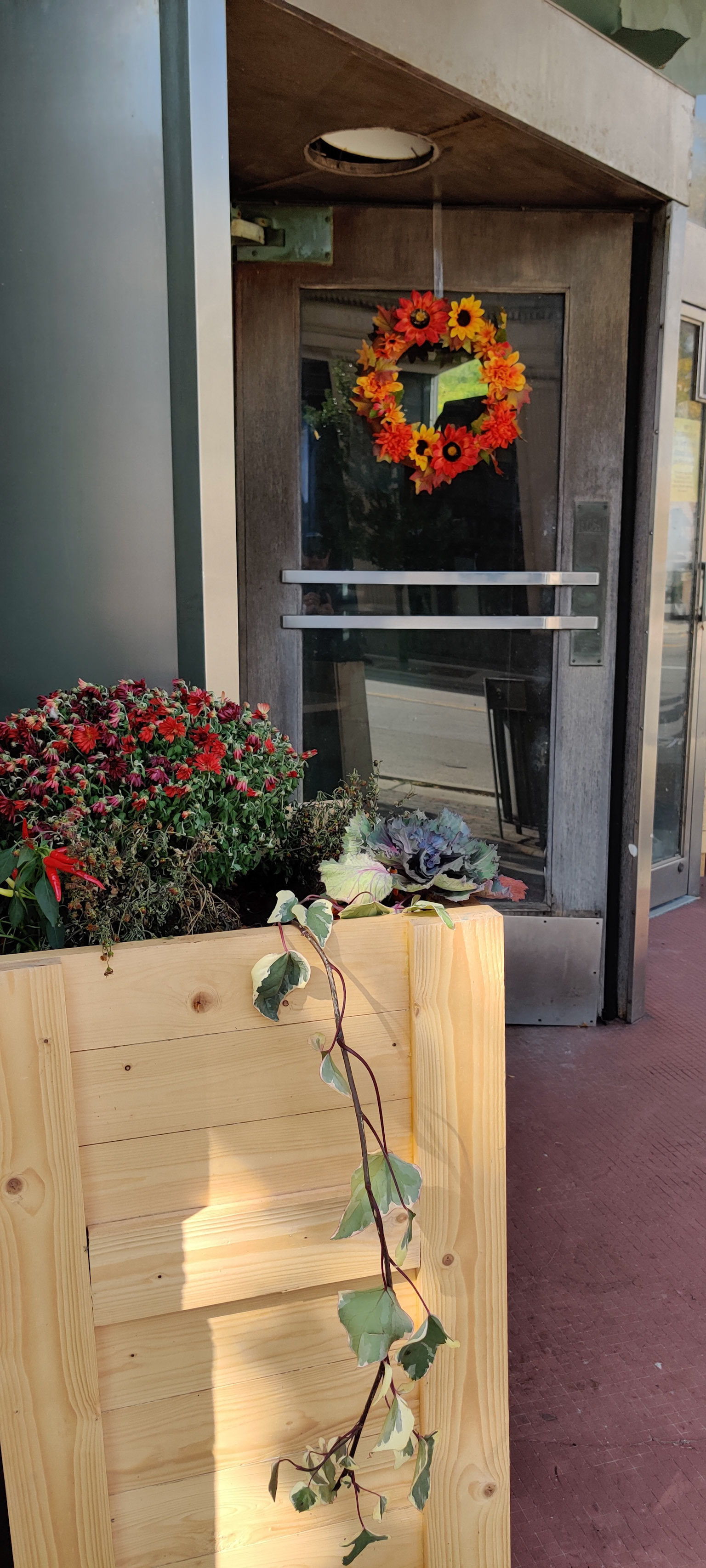 "New Pine, Dying Mums", 4 South Genesee Street, Waukegan, IL