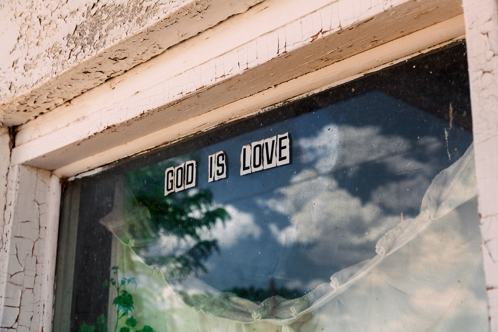 A door to an abandoned gas station office in Valentine, Texas.