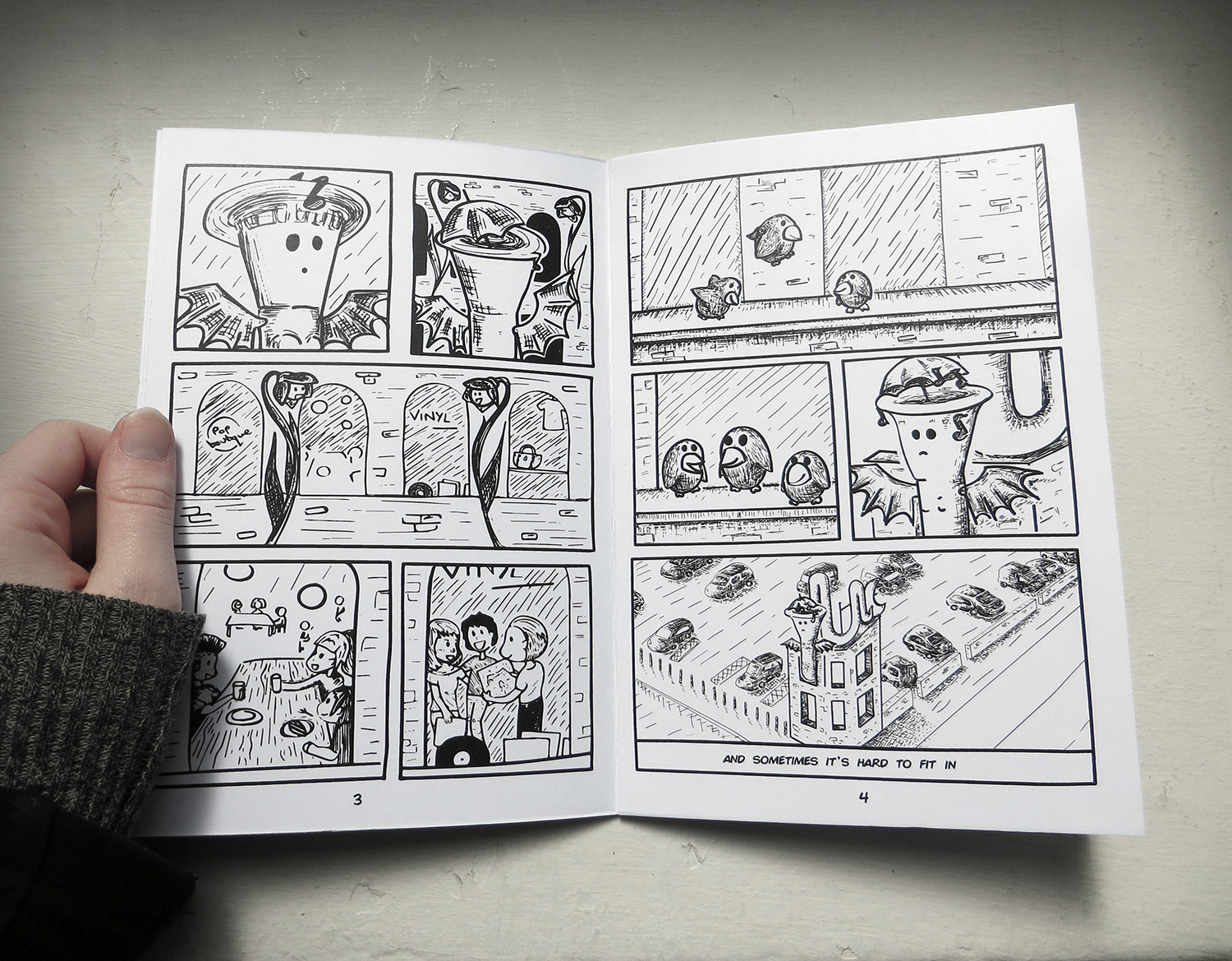 Pages 3-4 of the novel, showing the sculpture watching groups of friends and feeling alone
