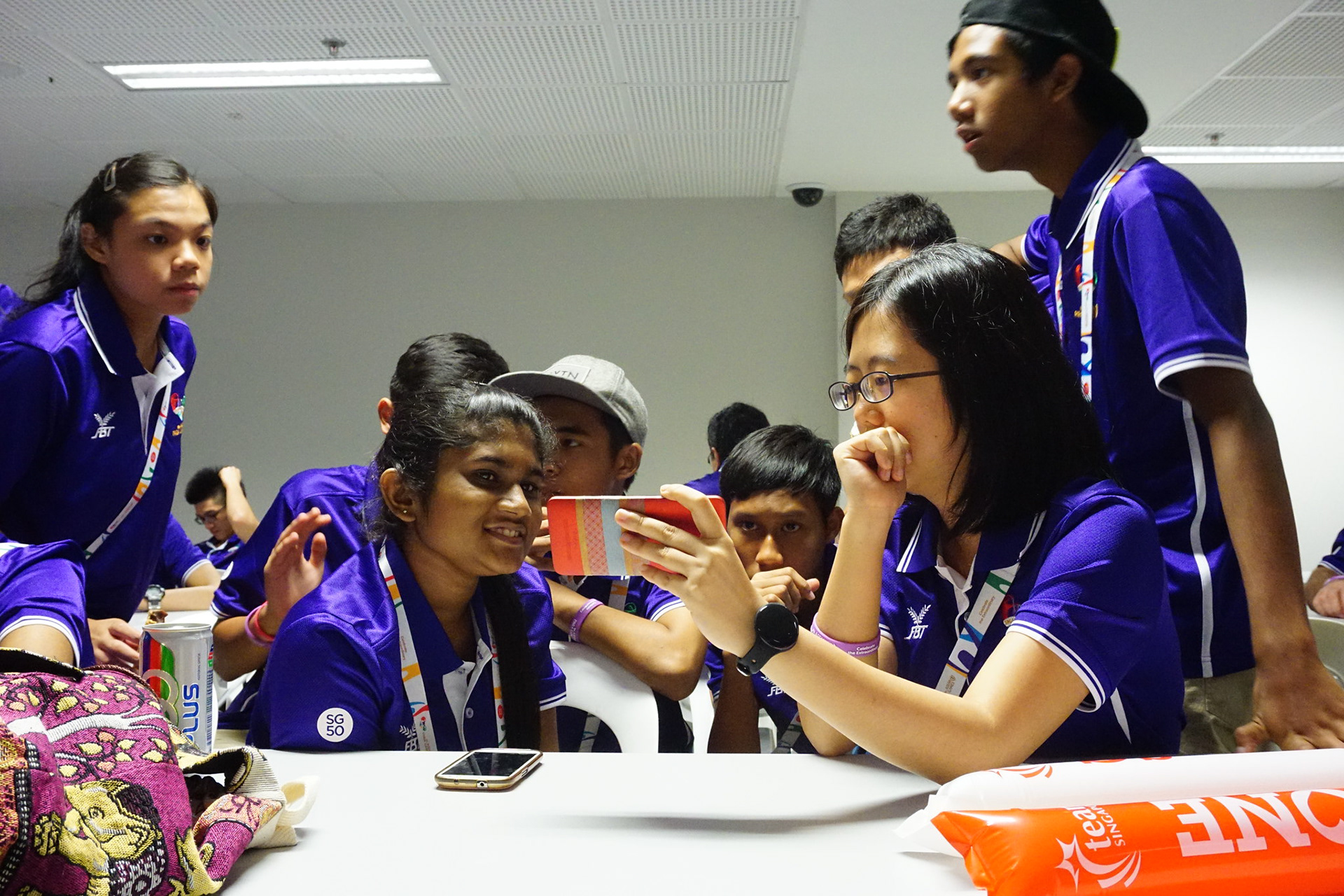 The tense look of the volunteers watching Singapore lose the football match.
