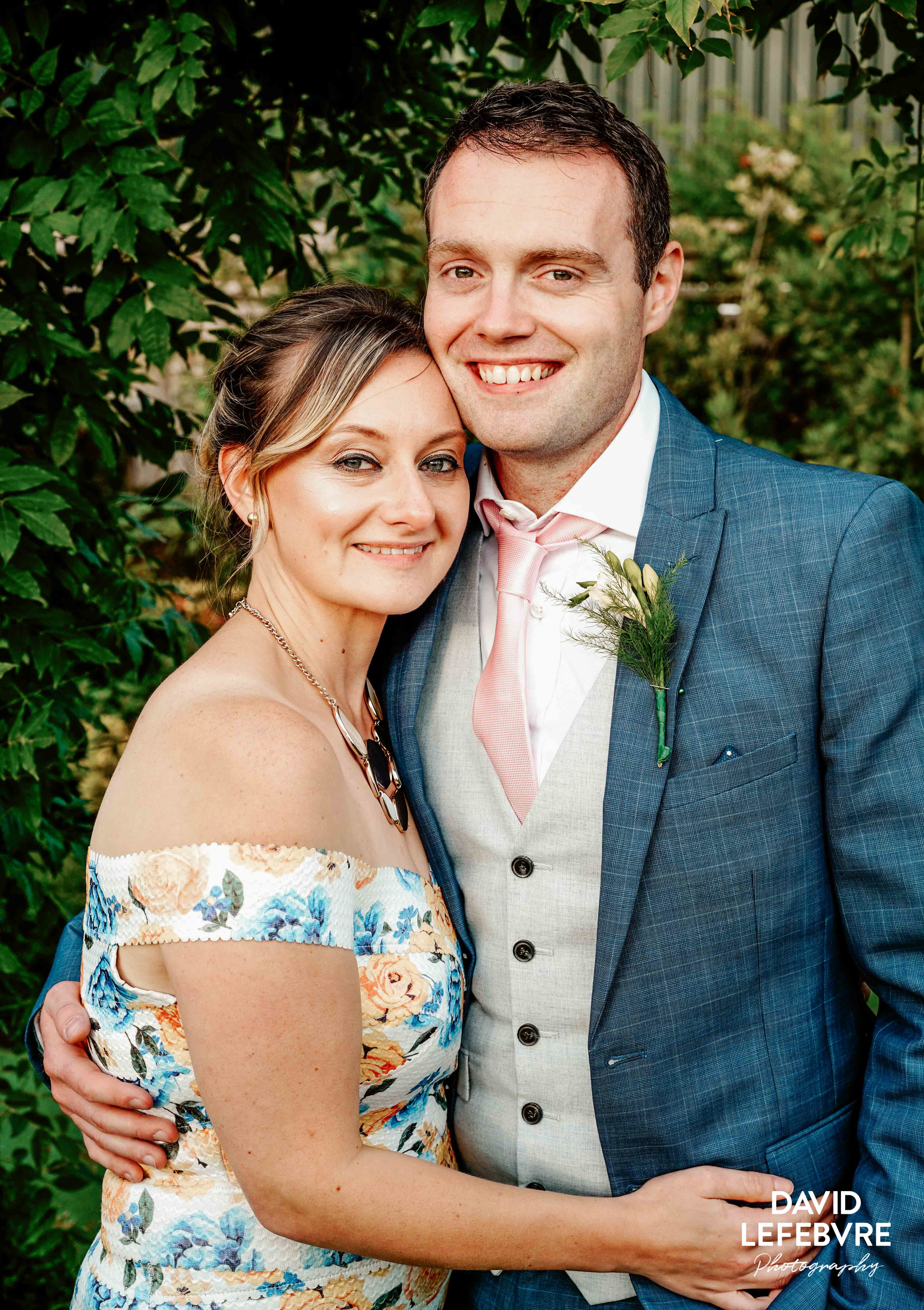 happy couple under canopy of leaves at owen house barn wedding venue