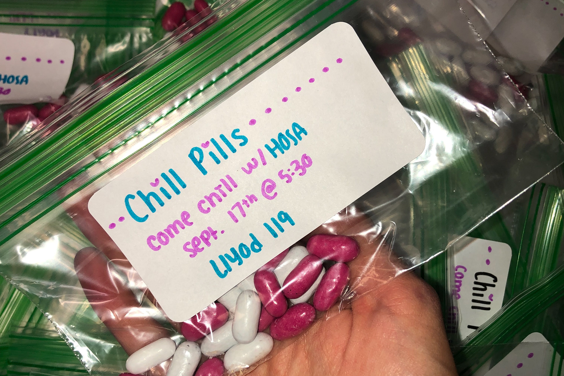 300 punny freebies-- of candy not actual pills ;)-- distributed to encourage attendance at semester's first meeting