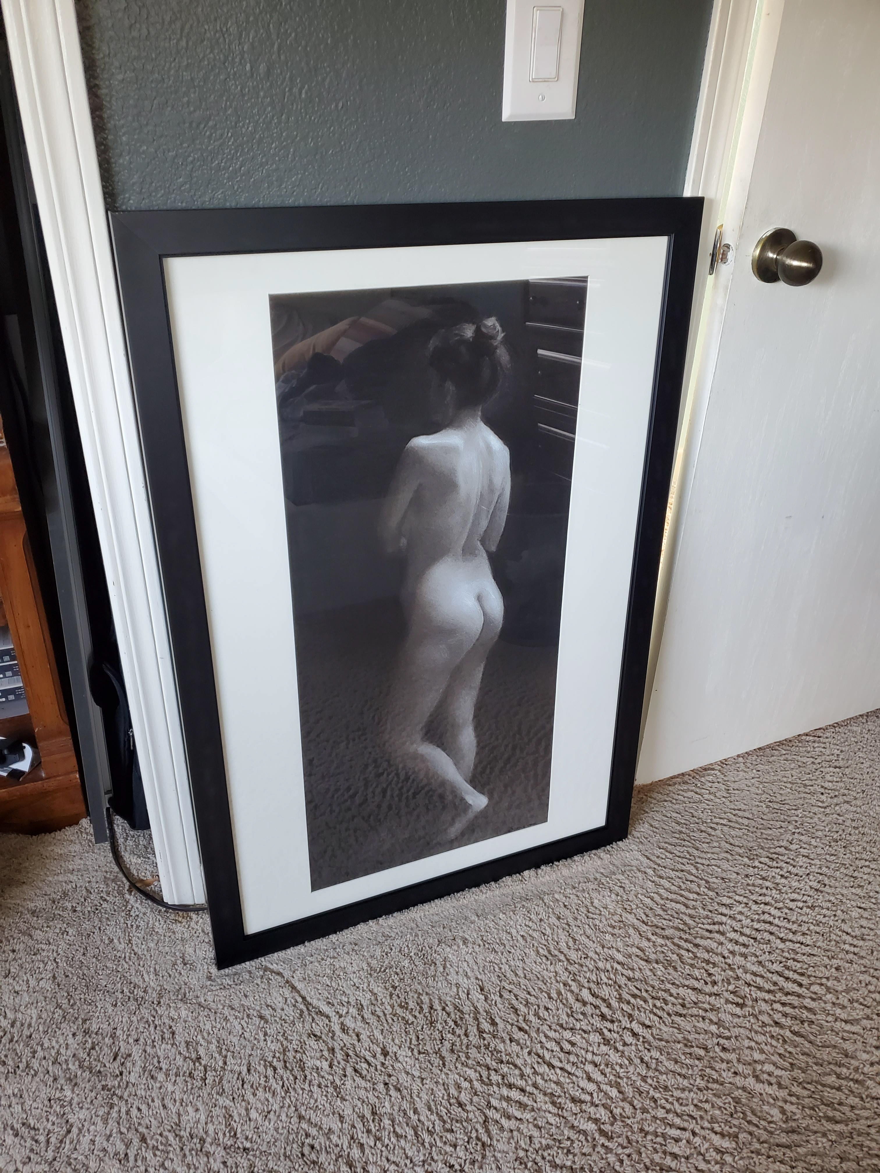 custom mat with black frame equipped with hanging hardware on back