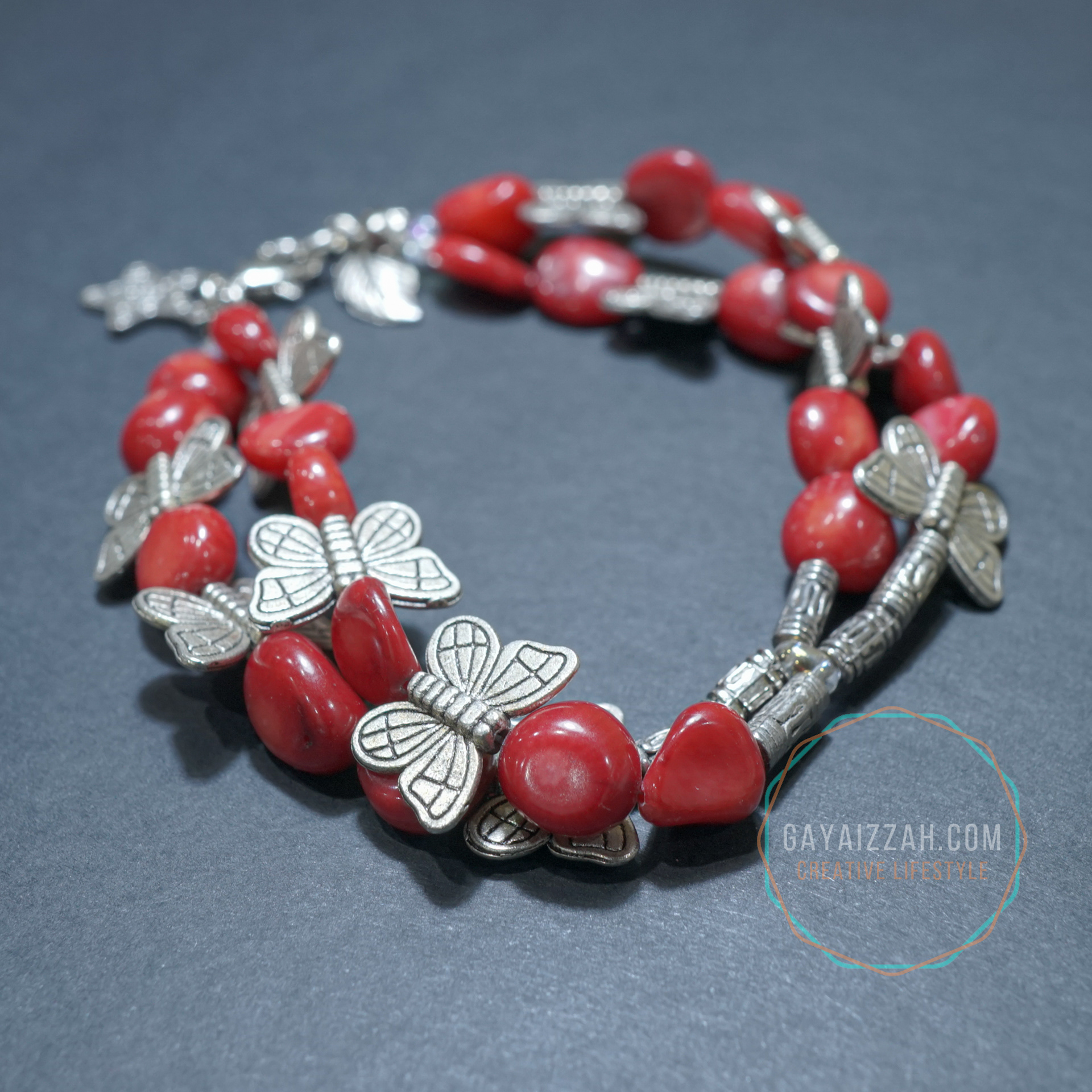 RM30. Corals and rhodium plated steel