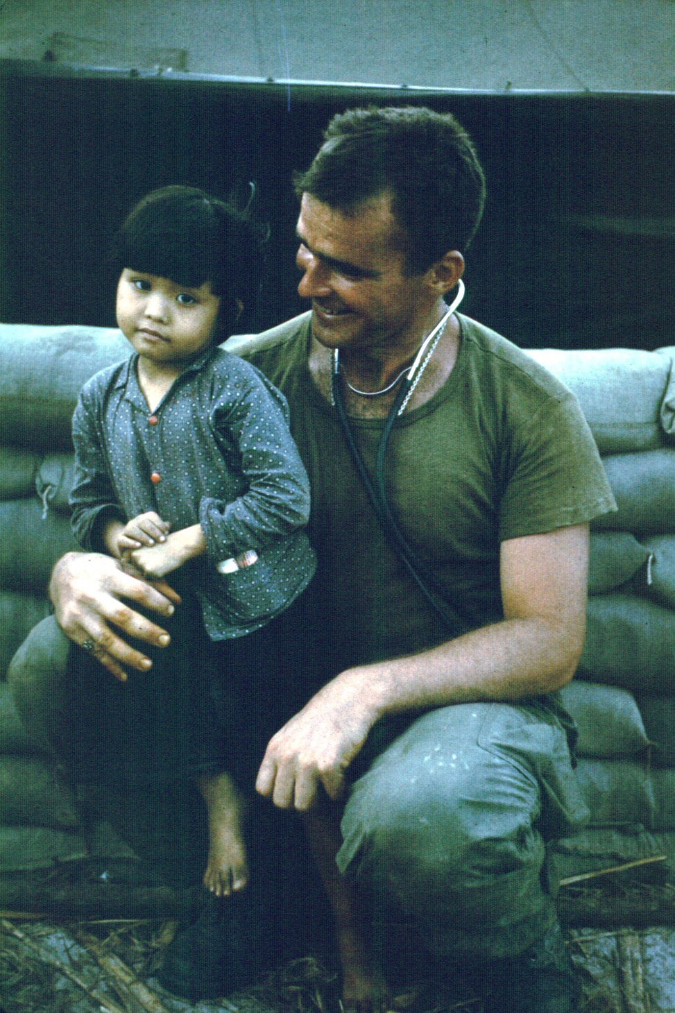 Recondo David Barmettler with Vietnamese child patient