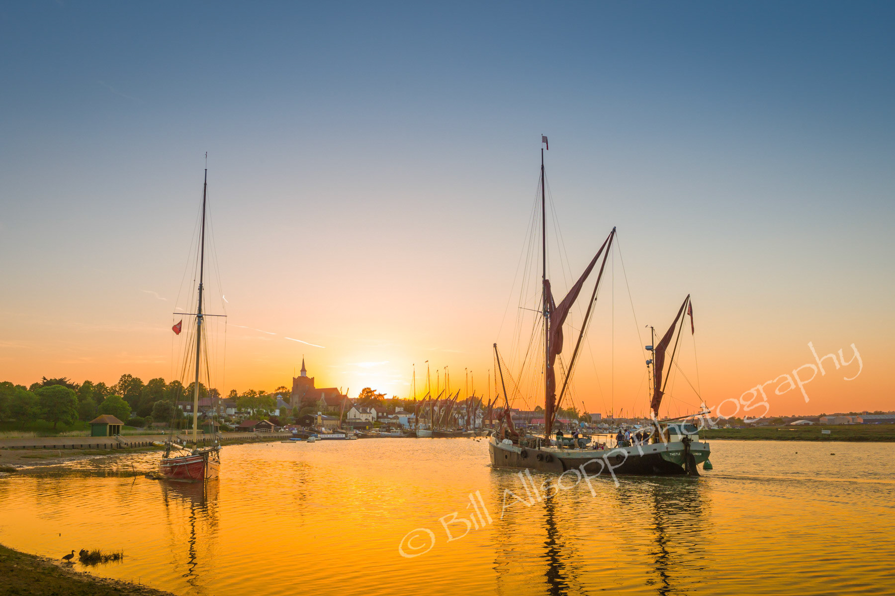 The last Thames sailing barge returns at sunset to Maldon quay.